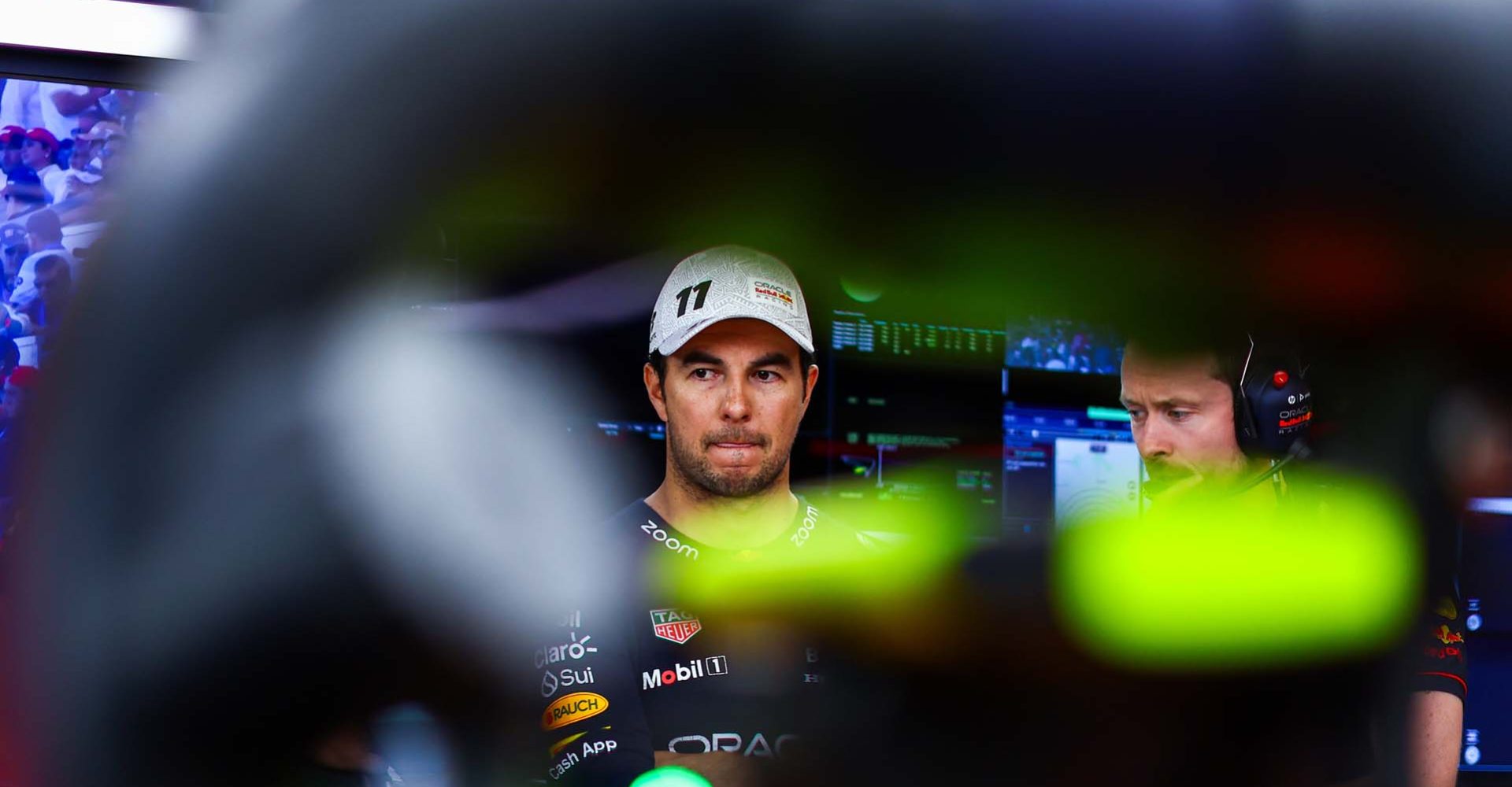 MEXICO CITY, MEXICO - OCTOBER 28: Sergio Perez of Mexico and Oracle Red Bull Racing looks on in the garage during qualifying ahead of the F1 Grand Prix of Mexico at Autodromo Hermanos Rodriguez on October 28, 2023 in Mexico City, Mexico. (Photo by Mark Thompson/Getty Images) // Getty Images / Red Bull Content Pool // SI202310280720 // Usage for editorial use only //