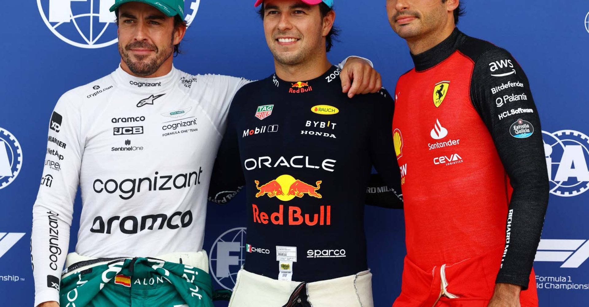 MIAMI, FLORIDA - MAY 06: Pole position qualifier Sergio Perez of Mexico and Oracle Red Bull Racing (C), Second placed qualifier Fernando Alonso of Spain and Aston Martin F1 Team (L) and Third placed qualifier Carlos Sainz of Spain and Ferrari (R) pose for a photo in parc ferme during qualifying ahead of the F1 Grand Prix of Miami at Miami International Autodrome on May 06, 2023 in Miami, Florida. (Photo by Mark Thompson/Getty Images)