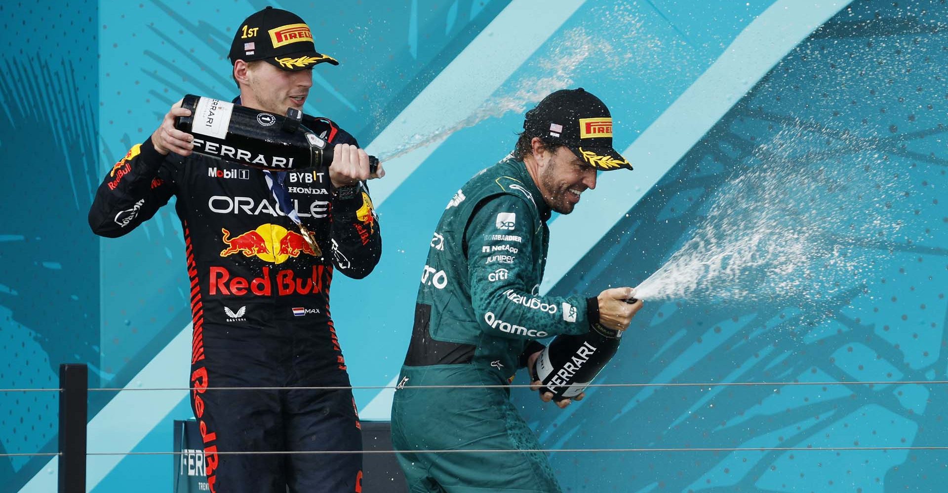 MIAMI, FLORIDA - MAY 07: Race winner Max Verstappen of the Netherlands and Oracle Red Bull Racing and Third placed Fernando Alonso of Spain and Aston Martin F1 Team celebrate on the podium during the F1 Grand Prix of Miami at Miami International Autodrome on May 07, 2023 in Miami, Florida. (Photo by Jared C. Tilton/Getty Images)