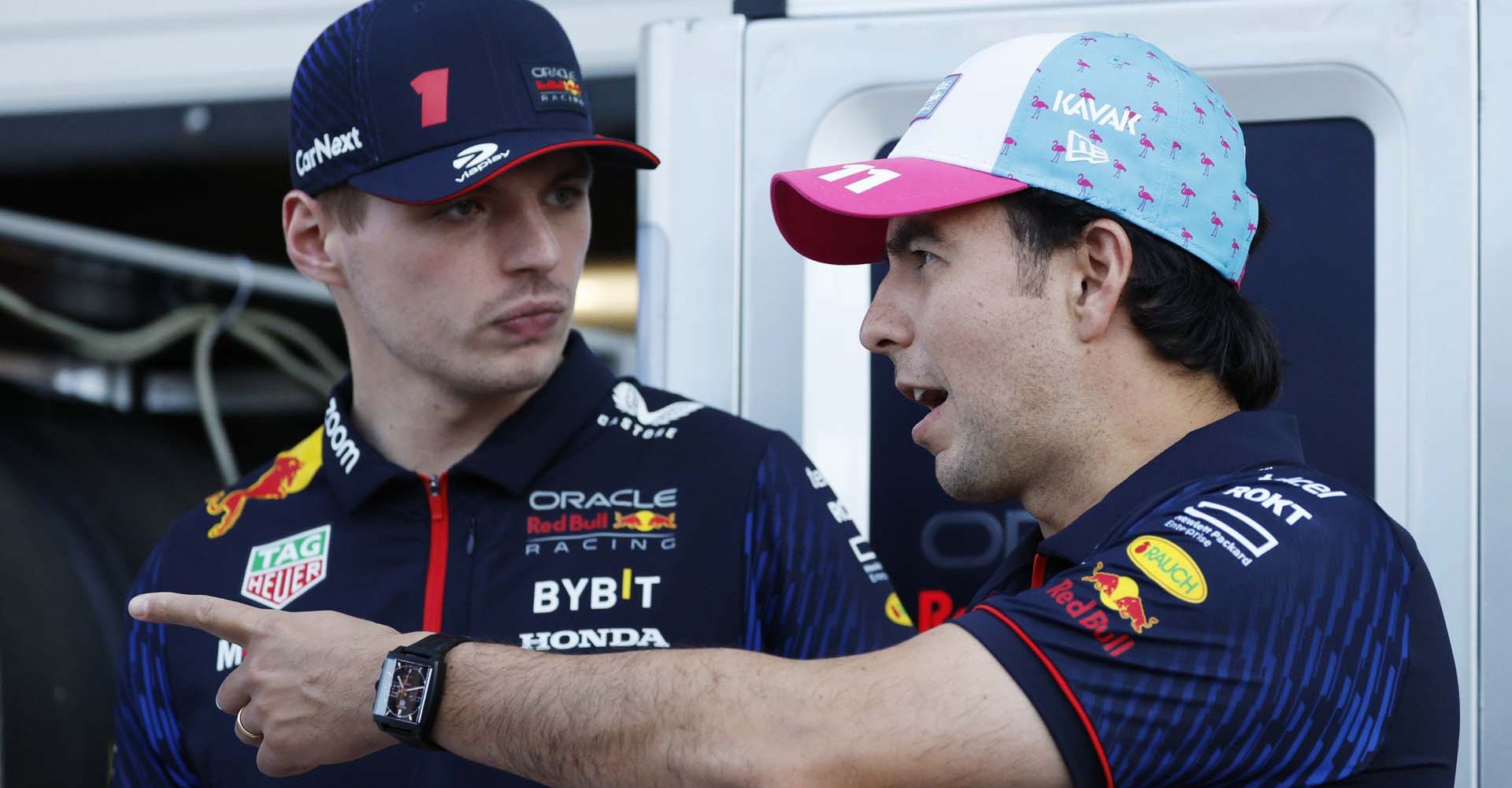 MIAMI, FLORIDA - MAY 04: Sergio Perez of Mexico and Oracle Red Bull Racing and Max Verstappen of the Netherlands and Oracle Red Bull Racing talk ahead of unveiling the one off livery for the Red Bull Racing RB19 designed by Martina Andriano during previews ahead of the F1 Grand Prix of Miami at Miami International Autodrome on May 04, 2023 in Miami, Florida. (Photo by Chris Graythen/Getty Images)