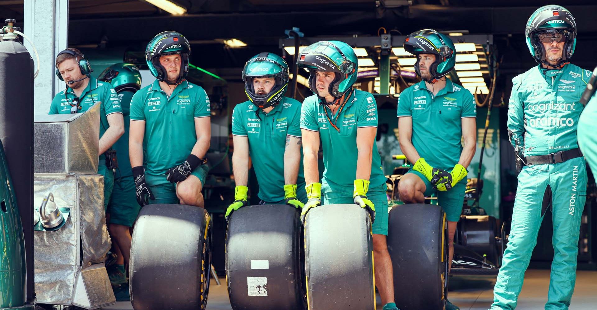 Aston Martin pit crew with Pirelli tyres