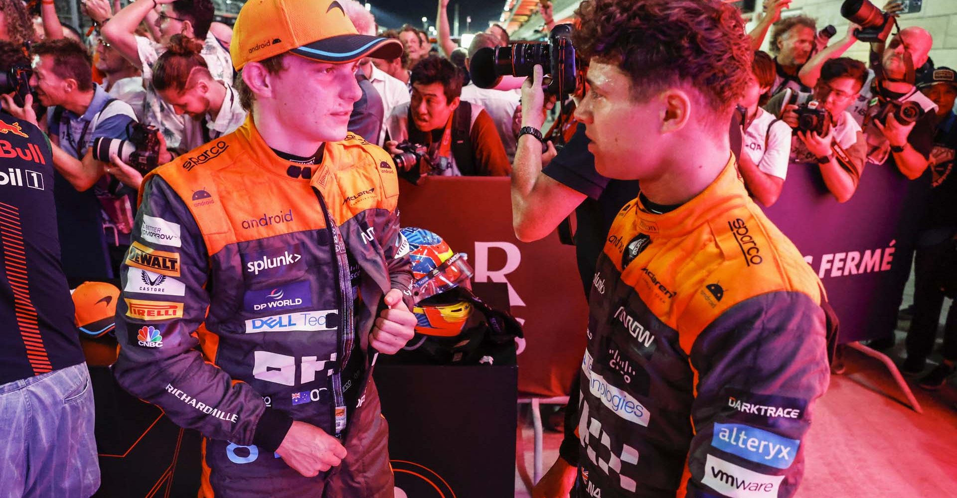 Oscar Piastri, McLaren, 1st position, and Lando Norris, McLaren, 3rd position, talk in Parc Ferme after the Sprint race