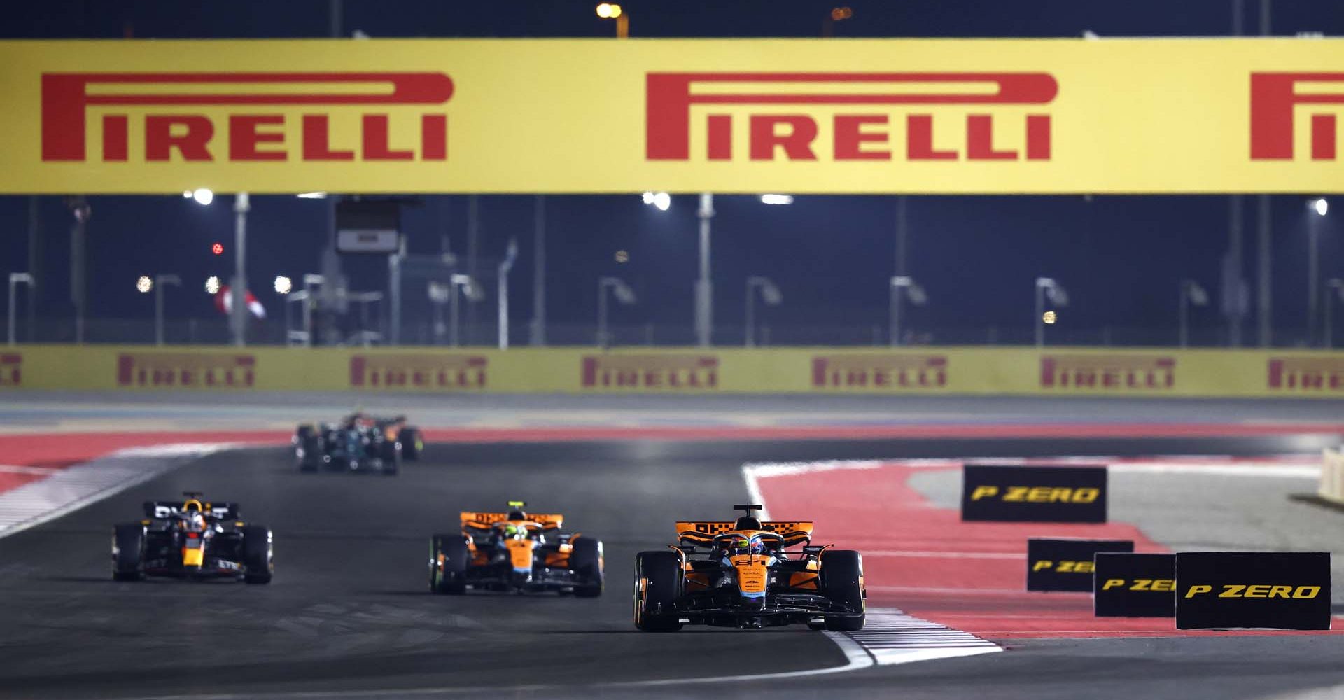 LOSAIL INTERNATIONAL CIRCUIT, QATAR - OCTOBER 07: Oscar Piastri, McLaren MCL60, leads Lando Norris, McLaren MCL60, and Max Verstappen, Red Bull Racing RB19 during the Qatar GP at Losail International Circuit on Saturday October 07, 2023 in Losail, Qatar. (Photo by Zak Mauger / LAT Images)