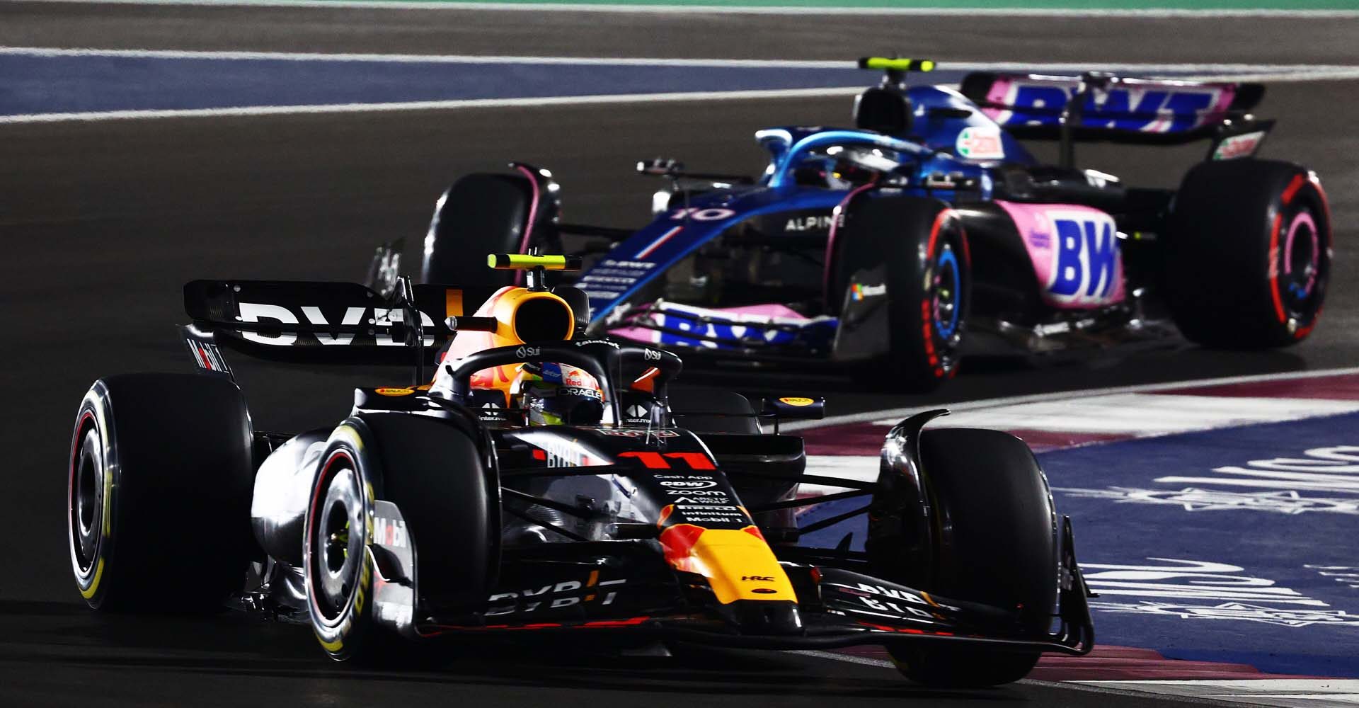 LUSAIL CITY, QATAR - OCTOBER 07: Sergio Perez of Mexico driving the (11) Oracle Red Bull Racing RB19 leads Pierre Gasly of France driving the (10) Alpine F1 A523 Renault during the Sprint ahead of the F1 Grand Prix of Qatar at Lusail International Circuit on October 07, 2023 in Lusail City, Qatar. (Photo by Clive Rose/Getty Images) // Getty Images / Red Bull Content Pool // SI202310070457 // Usage for editorial use only //