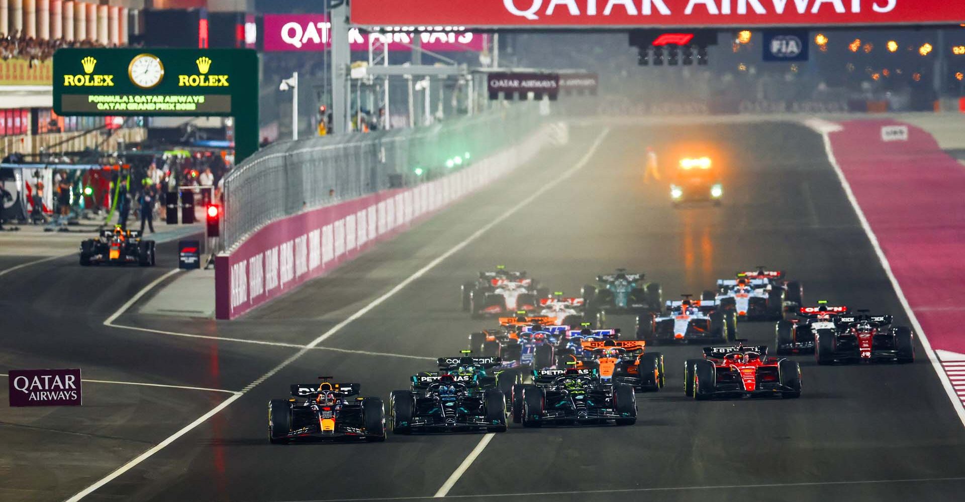 LUSAIL CITY, QATAR - OCTOBER 08: Max Verstappen of the Netherlands driving the (1) Oracle Red Bull Racing RB19 leads George Russell of Great Britain driving the (63) Mercedes AMG Petronas F1 Team W14, Lewis Hamilton of Great Britain driving the (44) Mercedes AMG Petronas F1 Team W14 and the rest of the field into turn one at the start during the F1 Grand Prix of Qatar at Lusail International Circuit on October 08, 2023 in Lusail City, Qatar. (Photo by Mark Thompson/Getty Images) // Getty Images / Red Bull Content Pool // SI202310080563 // Usage for editorial use only //