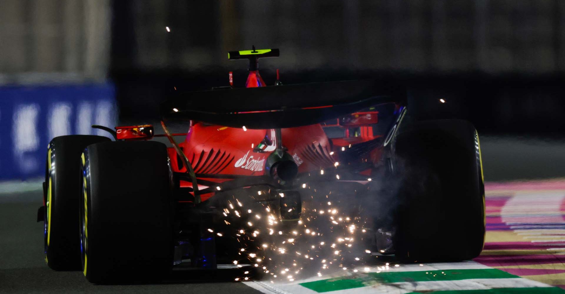 JEDDAH STREET CIRCUIT, SAUDI ARABIA - MARCH 17: Sparks trail from Carlos Sainz, Ferrari SF-23 during the Saudi Arabian GP at Jeddah Street Circuit on Friday March 17, 2023 in Jeddah, Saudi Arabia. (Photo by Glenn Dunbar / LAT Images)