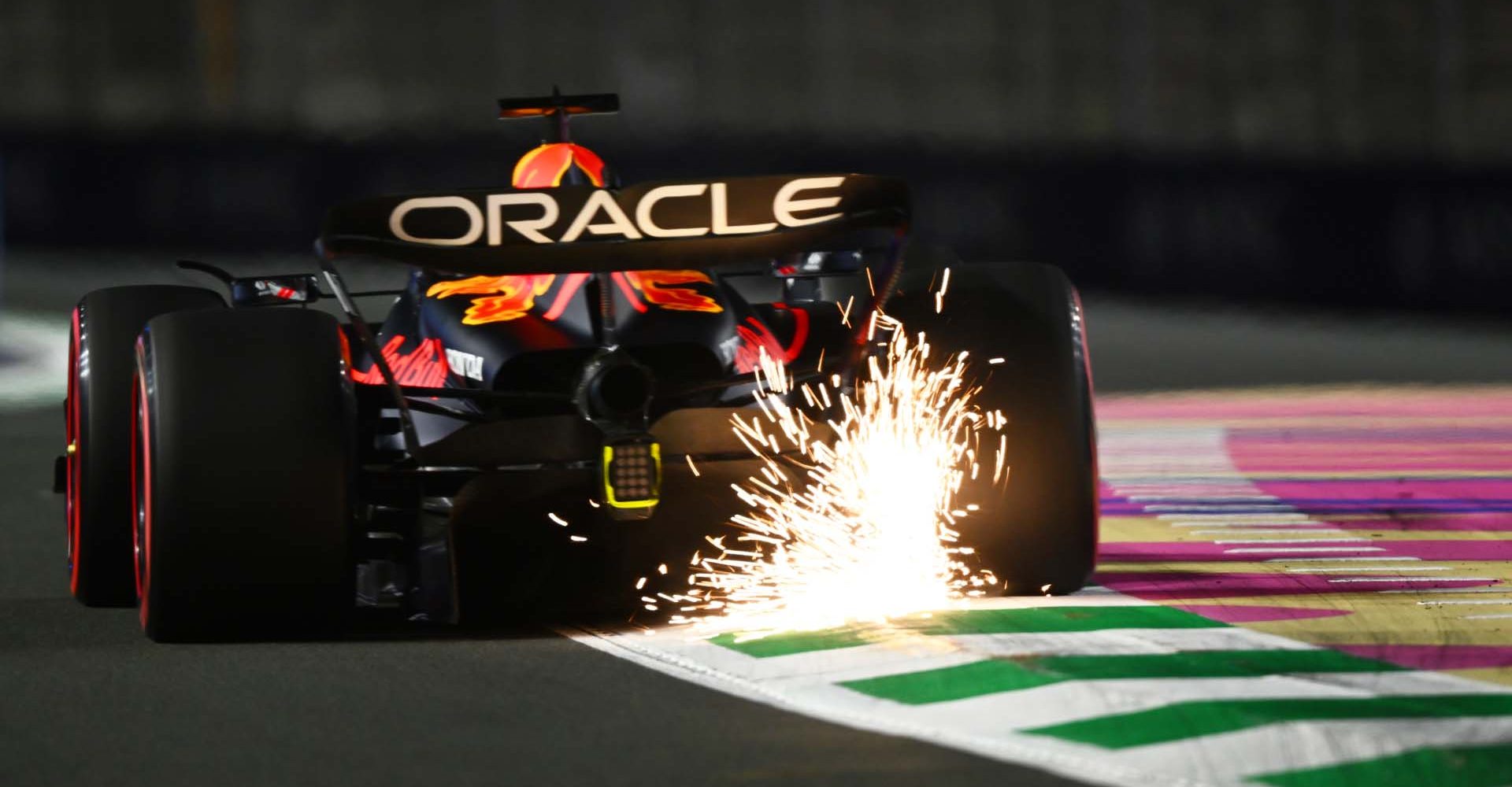 JEDDAH, SAUDI ARABIA - MARCH 17: Sparks fly behind Max Verstappen of the Netherlands driving the (1) Oracle Red Bull Racing RB19 during practice ahead of the F1 Grand Prix of Saudi Arabia at Jeddah Corniche Circuit on March 17, 2023 in Jeddah, Saudi Arabia. (Photo by Clive Mason/Getty Images)