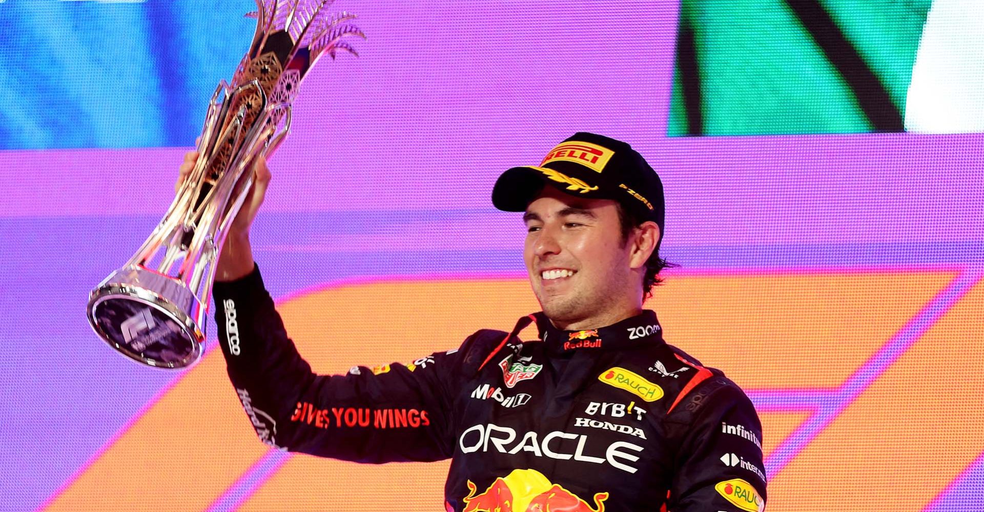 JEDDAH, SAUDI ARABIA - MARCH 19: Race winner Sergio Perez of Mexico and Oracle Red Bull Racing celebrates on the podium during the F1 Grand Prix of Saudi Arabia at Jeddah Corniche Circuit on March 19, 2023 in Jeddah, Saudi Arabia. (Photo by Lars Baron/Getty Images)