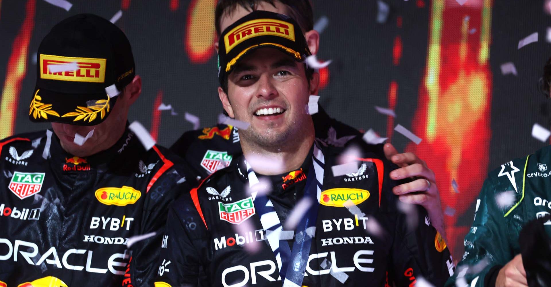 JEDDAH, SAUDI ARABIA - MARCH 19: Race winner Sergio Perez of Mexico and Oracle Red Bull Racing celebrates on the podium during the F1 Grand Prix of Saudi Arabia at Jeddah Corniche Circuit on March 19, 2023 in Jeddah, Saudi Arabia. (Photo by Lars Baron/Getty Images)