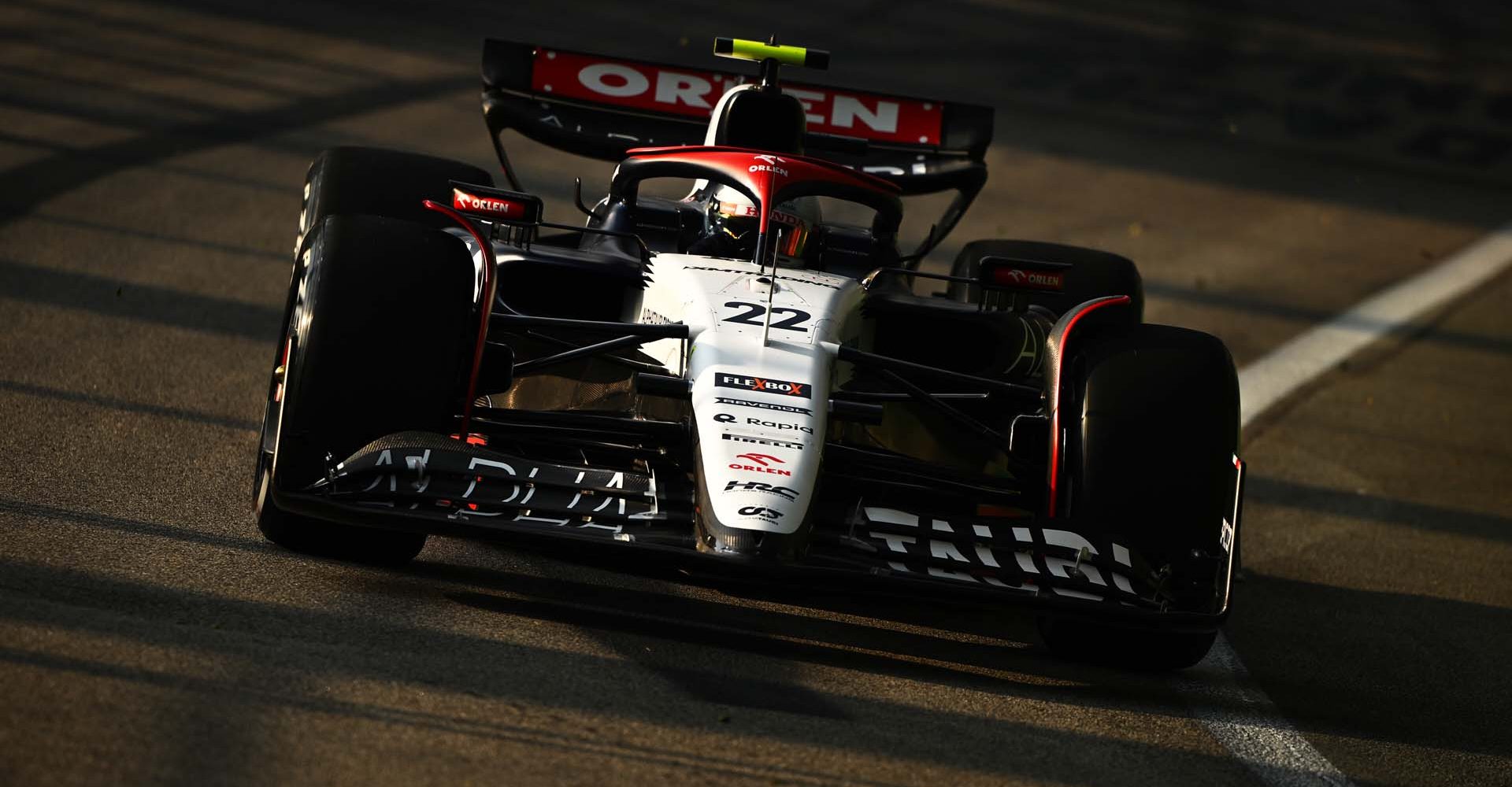 SINGAPORE, SINGAPORE - SEPTEMBER 15: Yuki Tsunoda of Japan driving the (22) Scuderia AlphaTauri AT04 on track during practice ahead of the F1 Grand Prix of Singapore at Marina Bay Street Circuit on September 15, 2023 in Singapore, Singapore. (Photo by Clive Mason/Getty Images) // Getty Images / Red Bull Content Pool // SI202309150513 // Usage for editorial use only //