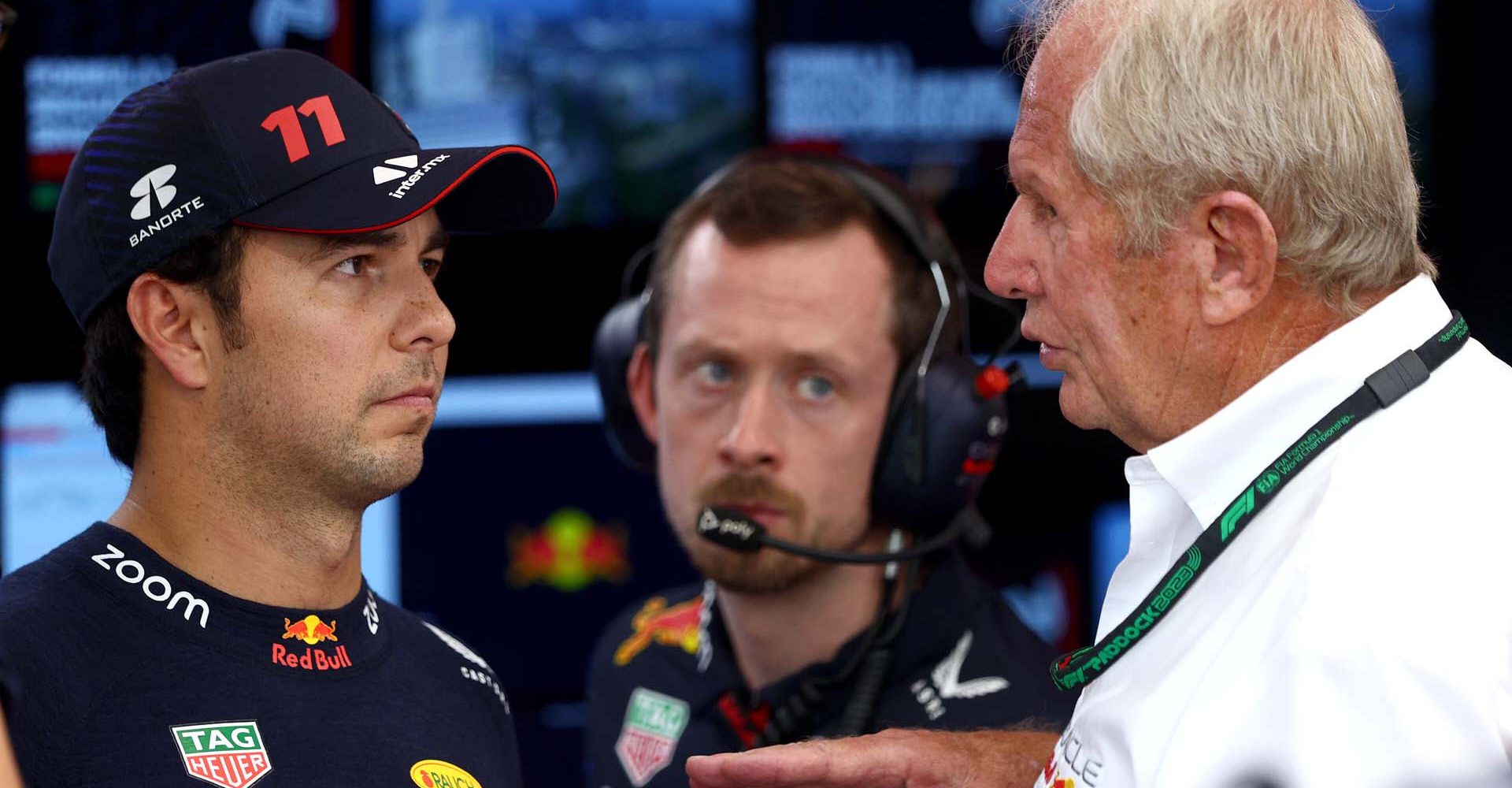 SINGAPORE, SINGAPORE - SEPTEMBER 15: Sergio Perez of Mexico and Oracle Red Bull Racing talks with Red Bull Racing Team Consultant Dr Helmut Marko in the garage during practice ahead of the F1 Grand Prix of Singapore at Marina Bay Street Circuit on September 15, 2023 in Singapore, Singapore. (Photo by Clive Rose/Getty Images) // Getty Images / Red Bull Content Pool // SI202309150404 // Usage for editorial use only //