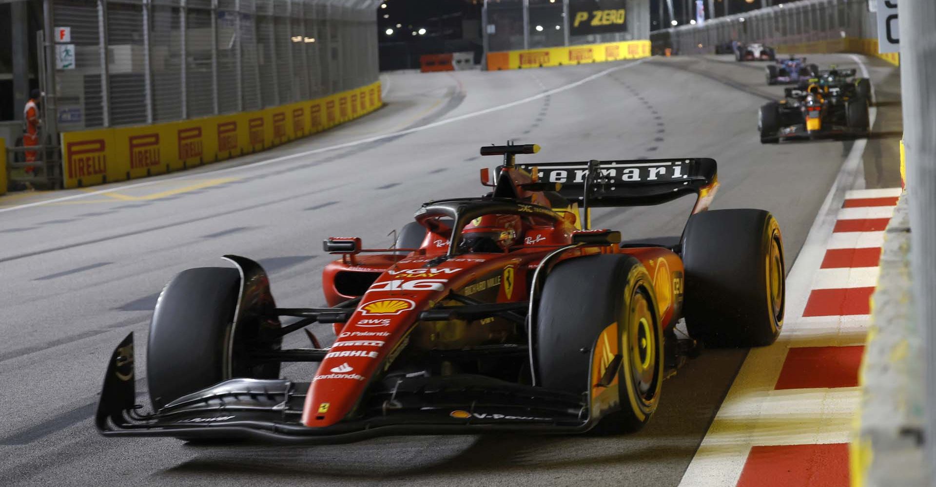 MARINA BAY STREET CIRCUIT, SINGAPORE - SEPTEMBER 17: Charles Leclerc, Ferrari SF-23, leads Sergio Perez, Red Bull Racing RB19 during the Singapore GP at Marina Bay Street Circuit on Sunday September 17, 2023 in Singapore, Singapore. (Photo by Glenn Dunbar / LAT Images)