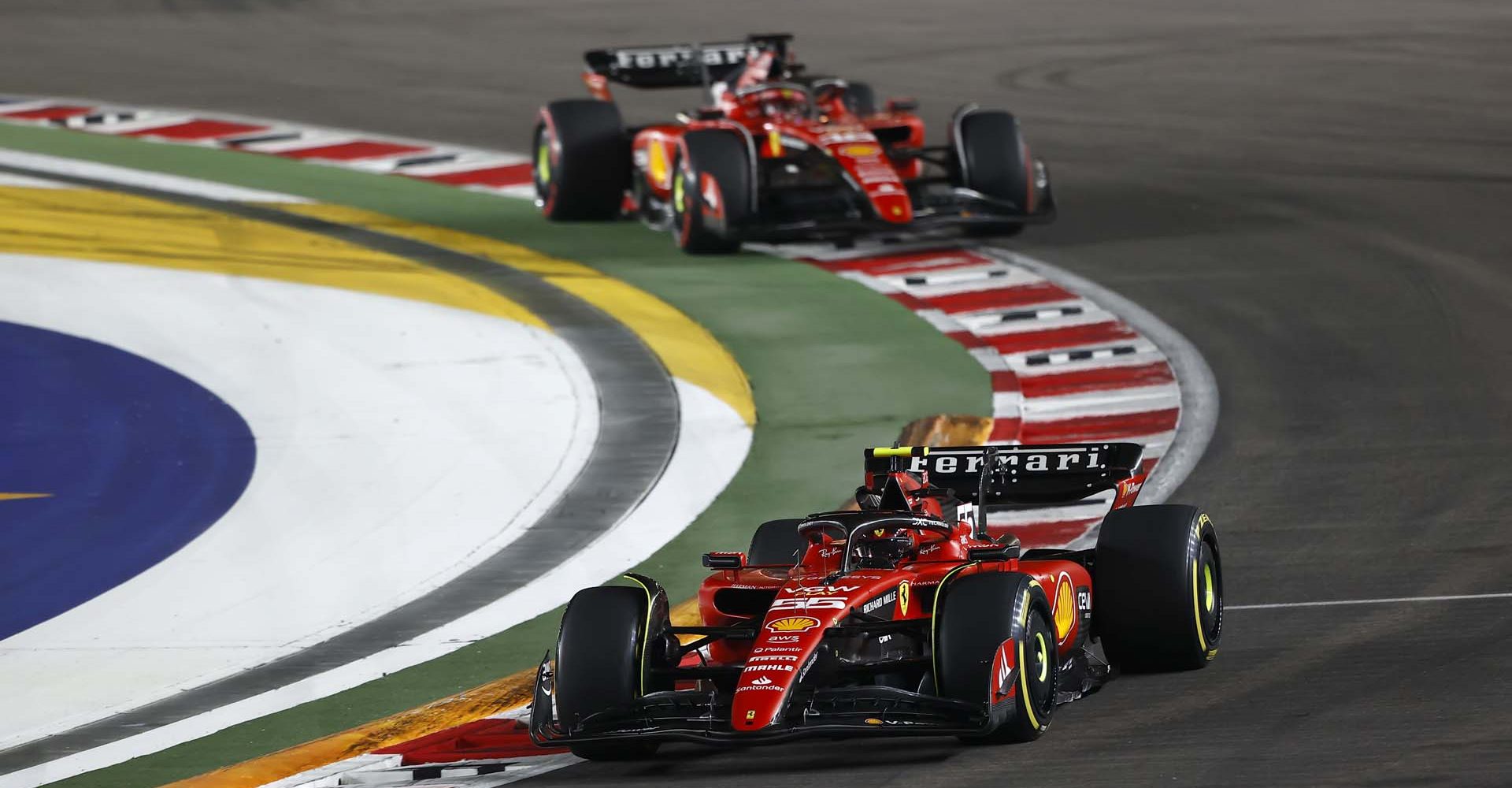 MARINA BAY STREET CIRCUIT, SINGAPORE - SEPTEMBER 17: Carlos Sainz, Ferrari SF-23, leads Charles Leclerc, Ferrari SF-23 during the Singapore GP at Marina Bay Street Circuit on Sunday September 17, 2023 in Singapore, Singapore. (Photo by Andy Hone / LAT Images)