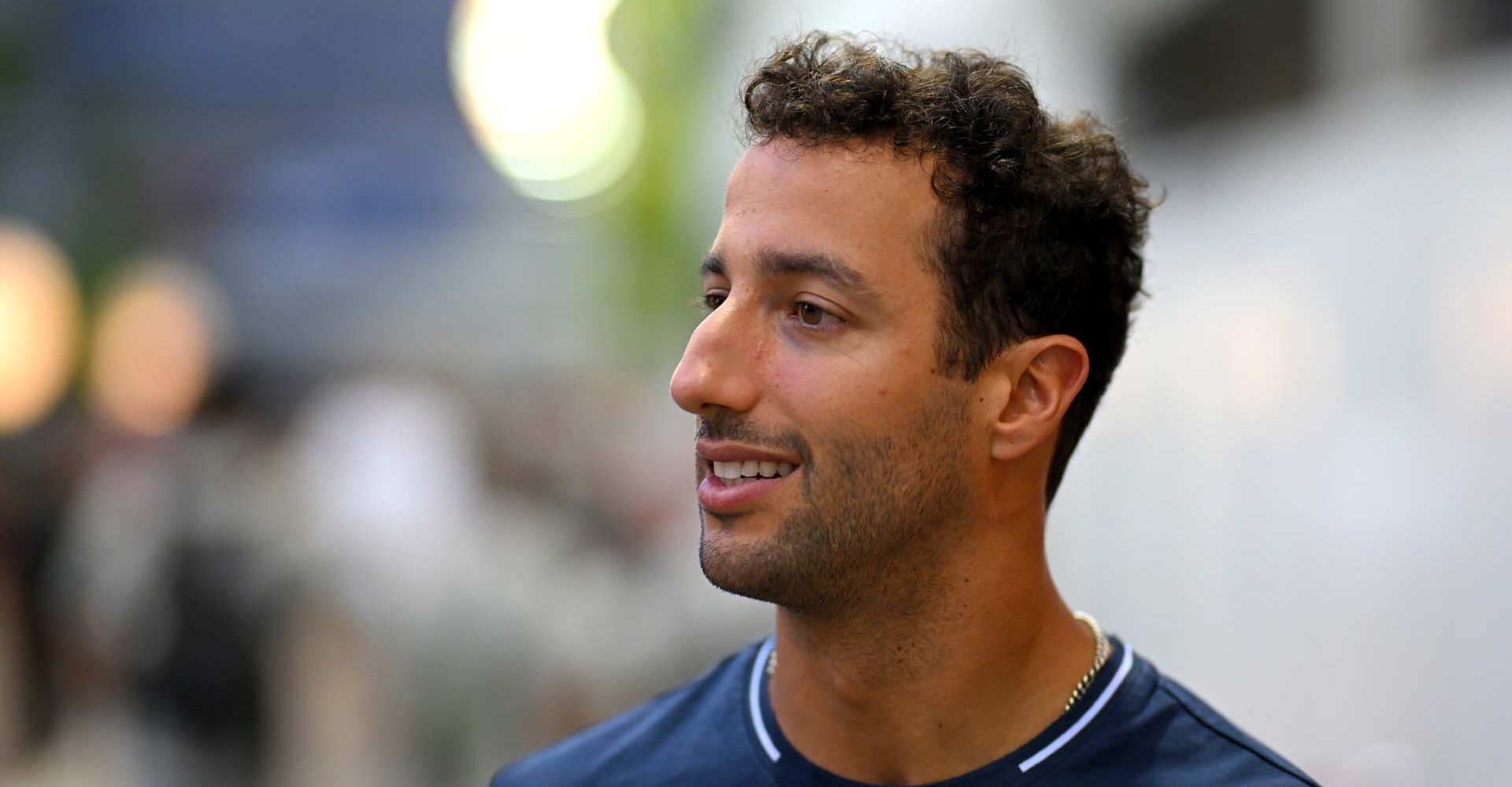 SINGAPORE, SINGAPORE - SEPTEMBER 14: Daniel Ricciardo of Australia and Scuderia AlphaTauri walks in the Paddock during previews ahead of the F1 Grand Prix of Singapore at Marina Bay Street Circuit on September 14, 2023 in Singapore, Singapore. (Photo by Clive Mason/Getty Images) // Getty Images / Red Bull Content Pool // SI202309140605 // Usage for editorial use only //