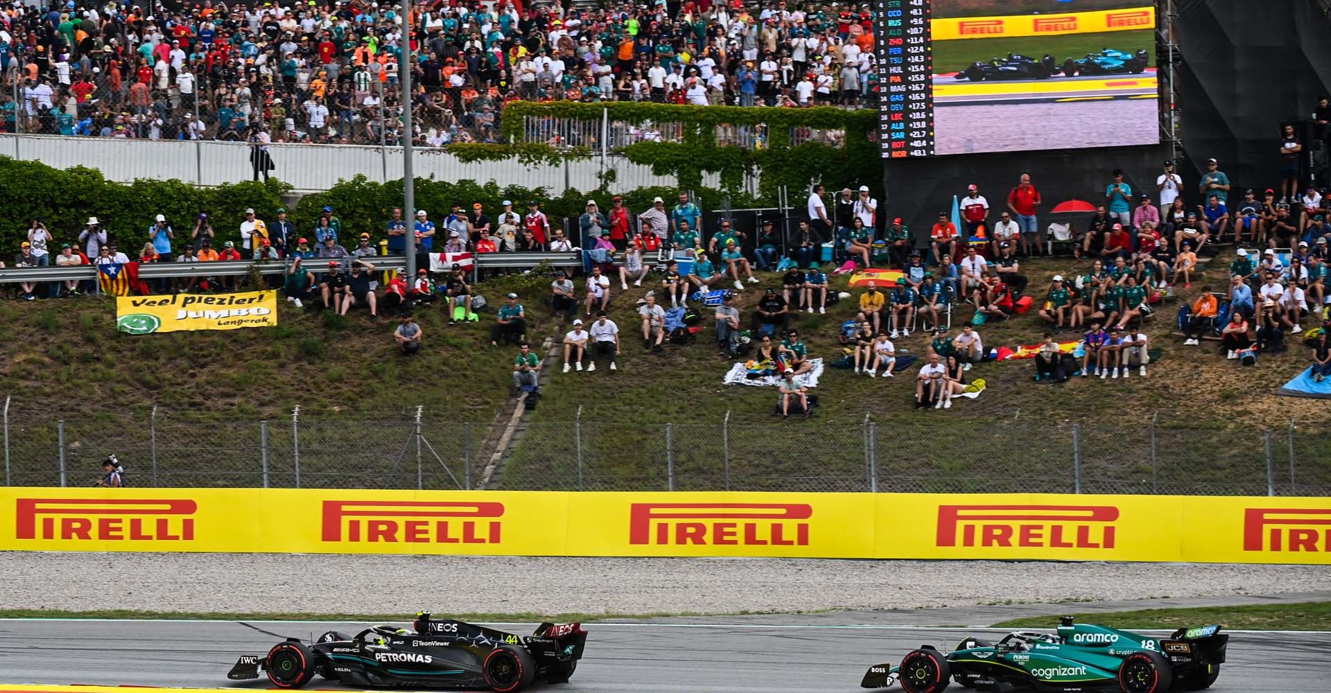 CIRCUIT DE BARCELONA-CATALUNYA, SPAIN - JUNE 04: Sir Lewis Hamilton, Mercedes F1 W14, leads Lance Stroll, Aston Martin AMR23 during the Spanish GP  at Circuit de Barcelona-Catalunya on Sunday June 04, 2023 in Barcelona, Spain. (Photo by Mark Sutton / LAT Images)