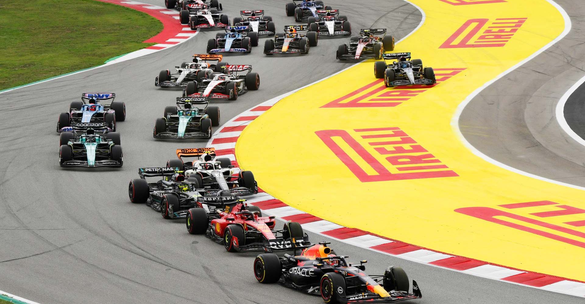 BARCELONA, SPAIN - JUNE 04: Max Verstappen of the Netherlands driving the (1) Oracle Red Bull Racing RB19 leads Carlos Sainz of Spain driving (55) the Ferrari SF-23 and the rest of the field at the start during the F1 Grand Prix of Spain at Circuit de Barcelona-Catalunya on June 04, 2023 in Barcelona, Spain. (Photo by David Ramos/Getty Images)