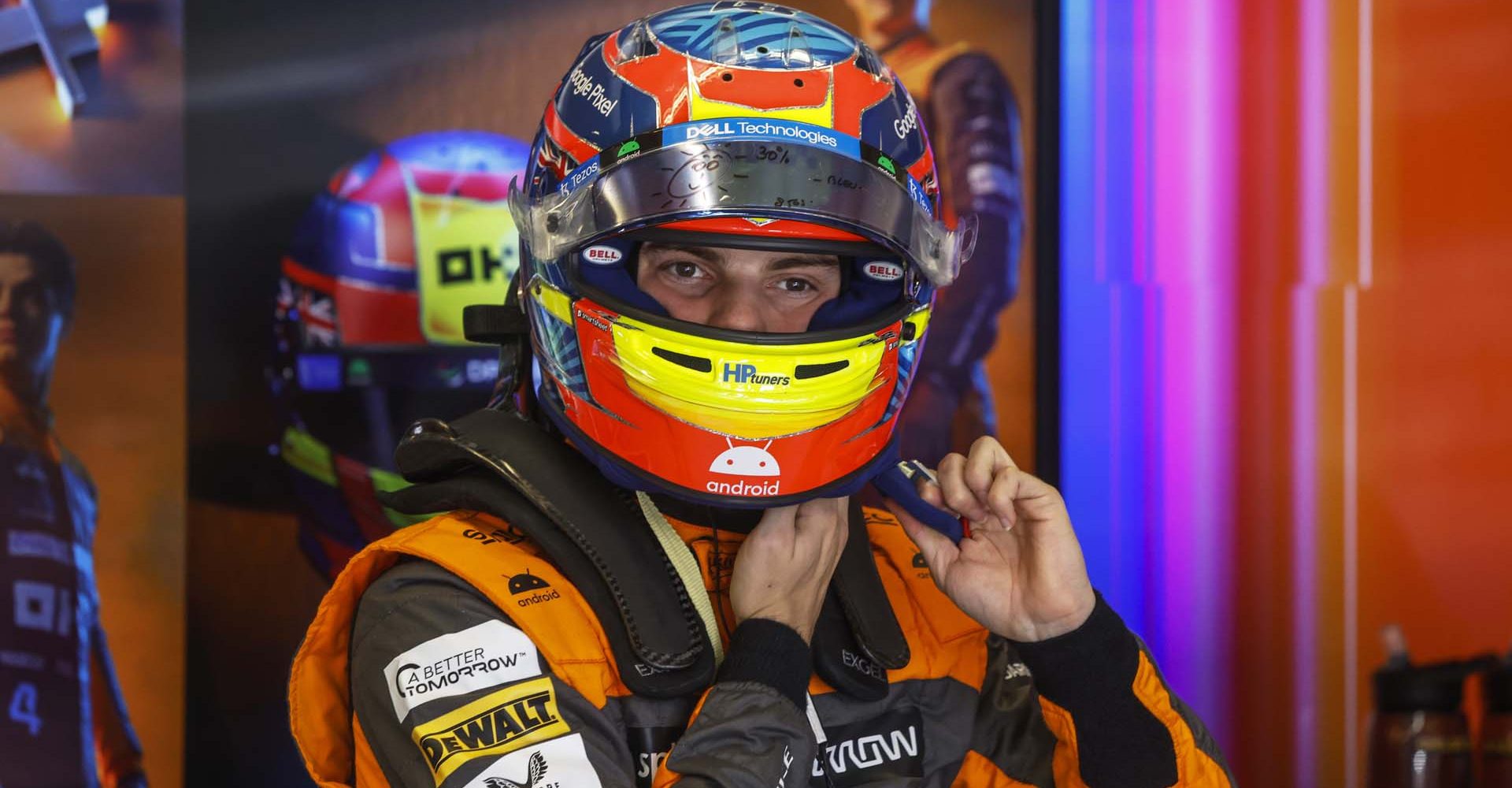 Oscar Piastri, McLaren, puts on his helmet ahead of qualifying