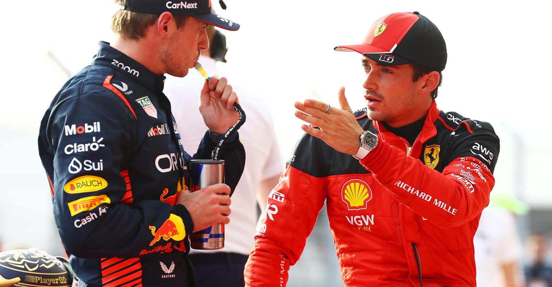 AUSTIN, TEXAS - OCTOBER 21: Sprint winner Max Verstappen of the Netherlands and Oracle Red Bull Racing and Third placed Charles Leclerc of Monaco and Ferrari talk in parc ferme during the Sprint ahead of the F1 Grand Prix of United States at Circuit of The Americas on October 21, 2023 in Austin, Texas. (Photo by Mark Thompson/Getty Images) // Getty Images / Red Bull Content Pool // SI202310220172 // Usage for editorial use only //