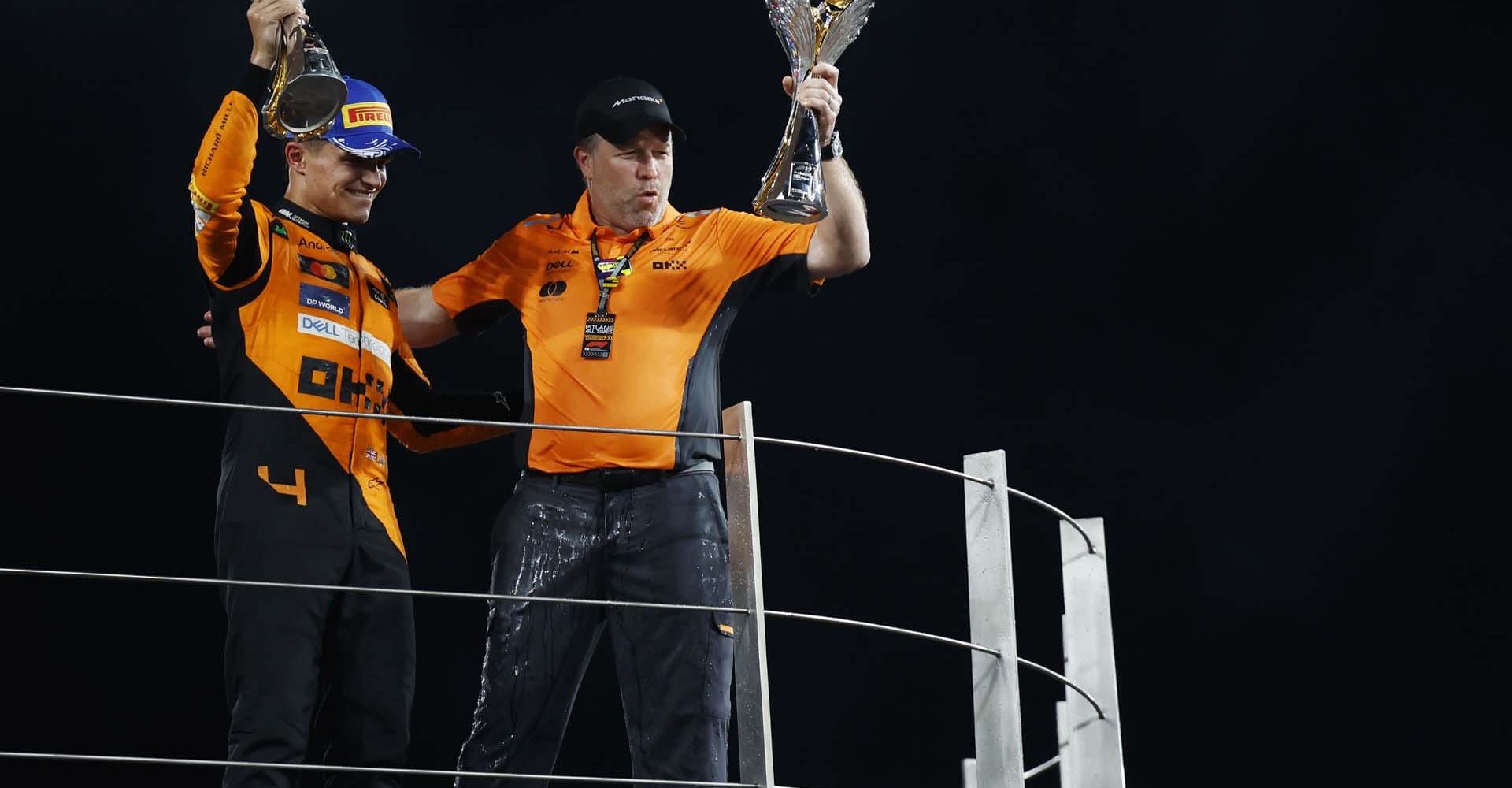 Lando Norris, McLaren F1 Team, 1st position, and Zak Brown, CEO, McLaren Racing, on the podium with the trophies