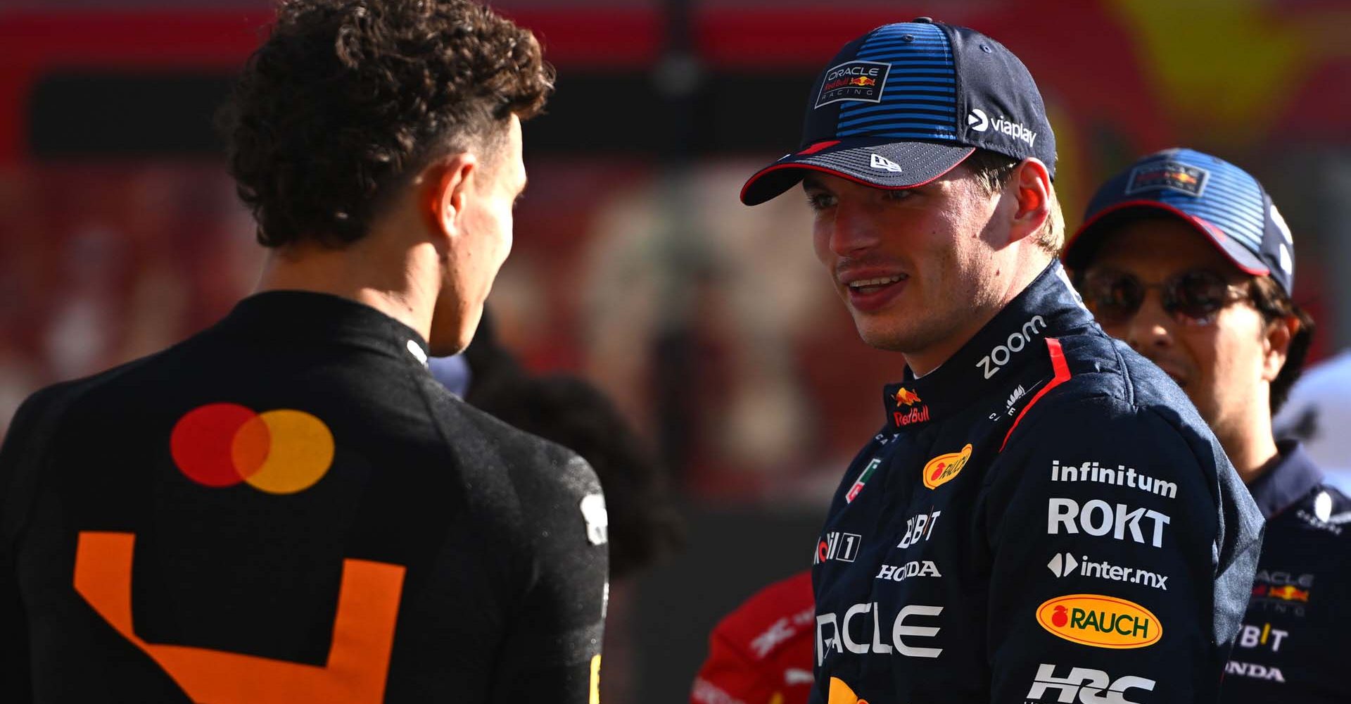 ABU DHABI, UNITED ARAB EMIRATES - DECEMBER 08: Max Verstappen of the Netherlands and Oracle Red Bull Racing and Lando Norris of Great Britain and McLaren talk  prior to the F1 Grand Prix of Abu Dhabi at Yas Marina Circuit on December 08, 2024 in Abu Dhabi, United Arab Emirates. (Photo by Rudy Carezzevoli/Getty Images) // Getty Images / Red Bull Content Pool // SI202412080093 // Usage for editorial use only //