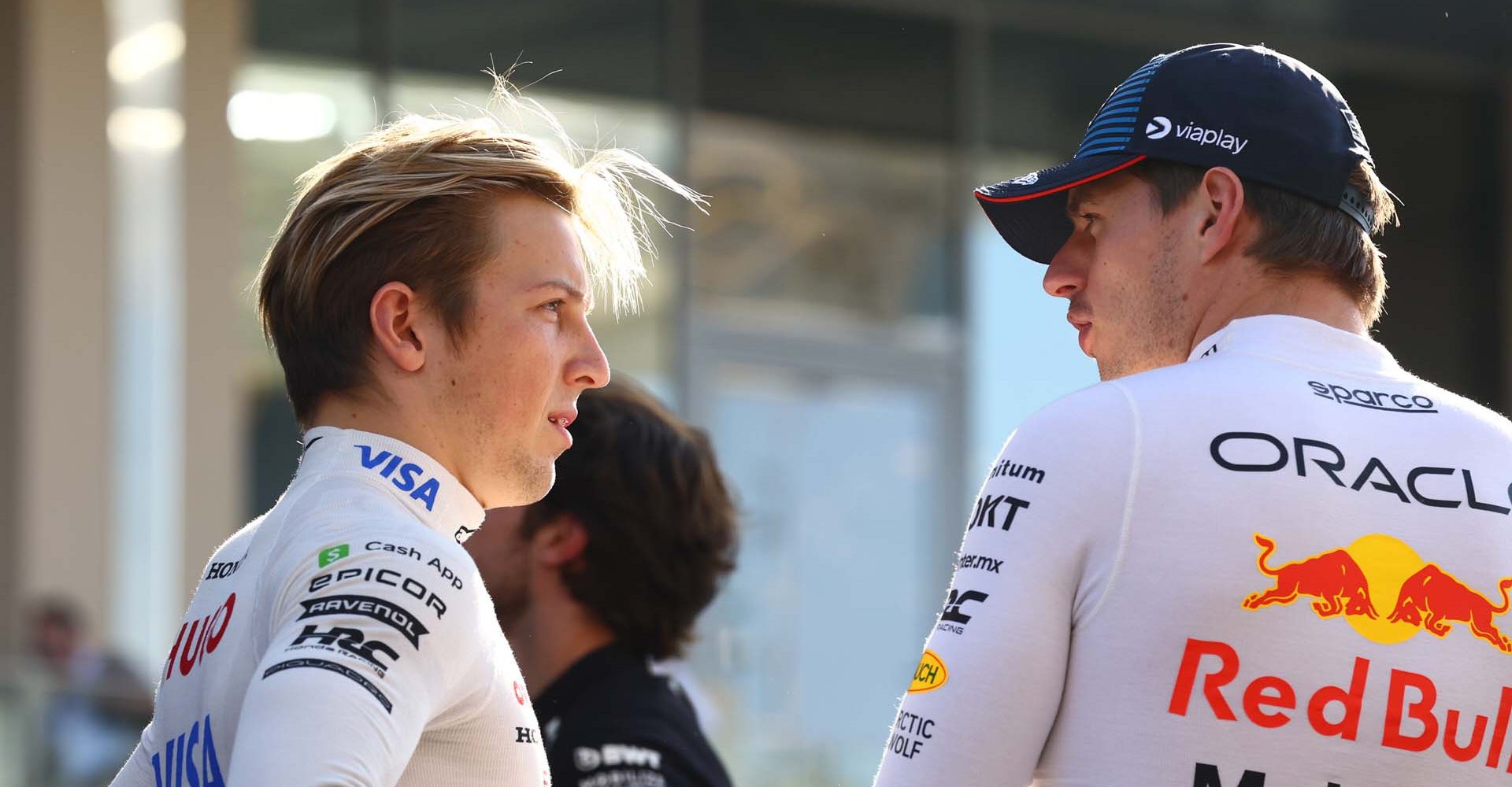 ABU DHABI, UNITED ARAB EMIRATES - DECEMBER 08: Liam Lawson of New Zealand and Visa Cash App RB talks to Max Verstappen of the Netherlands and Oracle Red Bull Racing prior to the F1 Grand Prix of Abu Dhabi at Yas Marina Circuit on December 08, 2024 in Abu Dhabi, United Arab Emirates. (Photo by Mark Thompson/Getty Images) // Getty Images / Red Bull Content Pool // SI202412080110 // Usage for editorial use only //