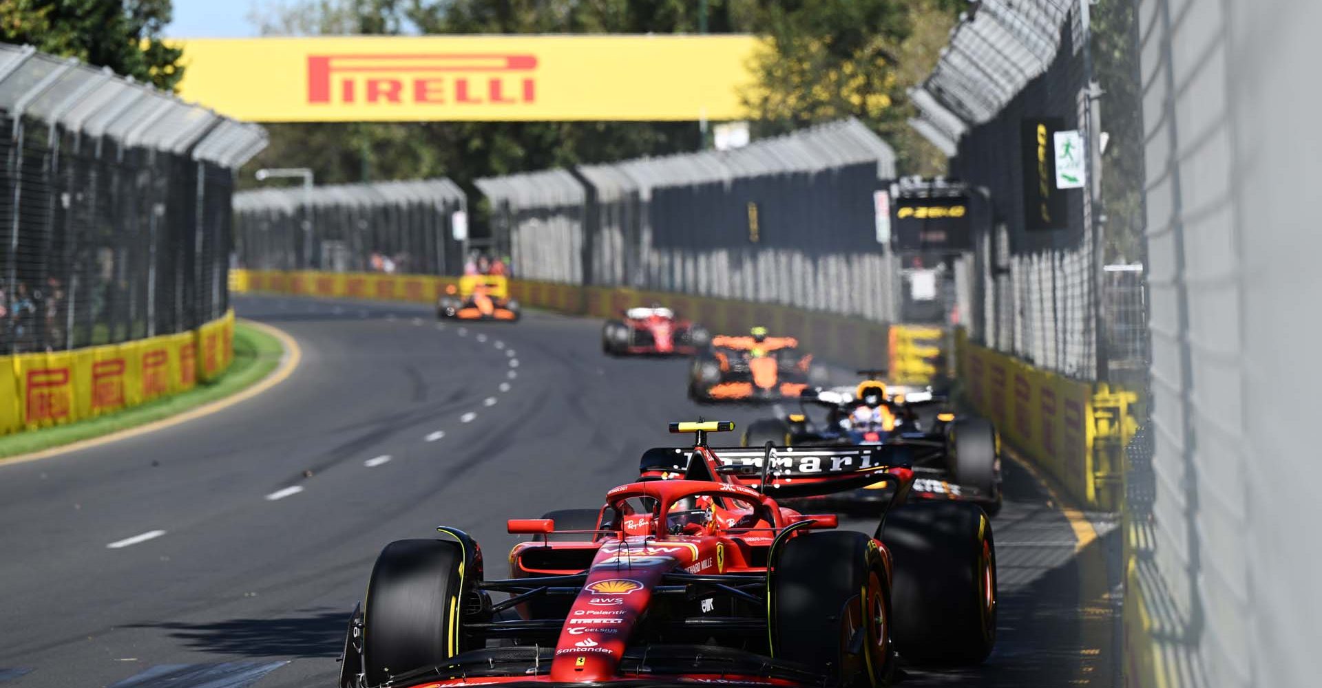 MELBOURNE GRAND PRIX CIRCUIT, AUSTRALIA - MARCH 24: Carlos Sainz, Ferrari SF-24, leads Max Verstappen, Red Bull Racing RB20, and Lando Norris, McLaren MCL38 during the Australian GP at Melbourne Grand Prix Circuit on Sunday March 24, 2024 in Melbourne, Australia. (Photo by Sam Bagnall / LAT Images)