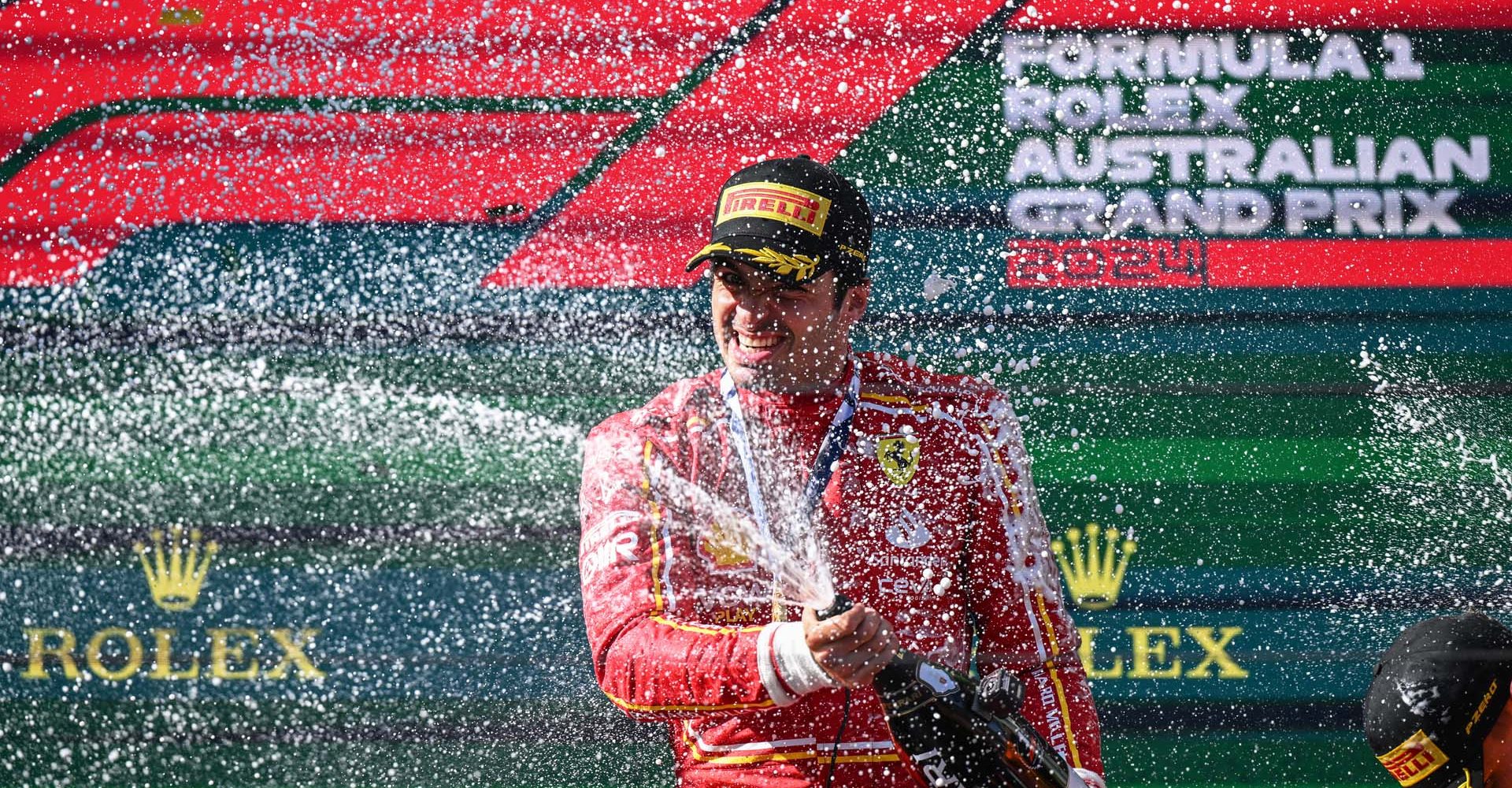 MELBOURNE GRAND PRIX CIRCUIT, AUSTRALIA - MARCH 24: Carlos Sainz, Scuderia Ferrari, 1st position, sprays the victory Champagne during the Australian GP at Melbourne Grand Prix Circuit on Sunday March 24, 2024 in Melbourne, Australia. (Photo by Sam Bagnall / LAT Images)