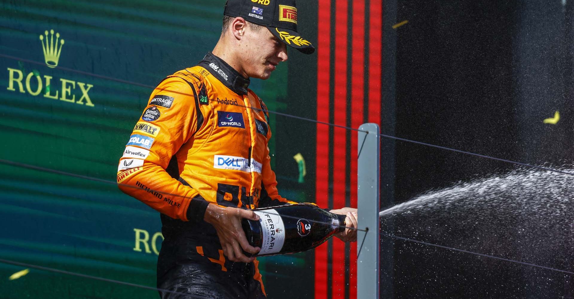 MELBOURNE GRAND PRIX CIRCUIT, AUSTRALIA - MARCH 24: Lando Norris, McLaren F1 Team, 3rd position, sprays champagne in celebration during the Australian GP at Melbourne Grand Prix Circuit on Sunday March 24, 2024 in Melbourne, Australia. (Photo by Andrew Ferraro / LAT Images)