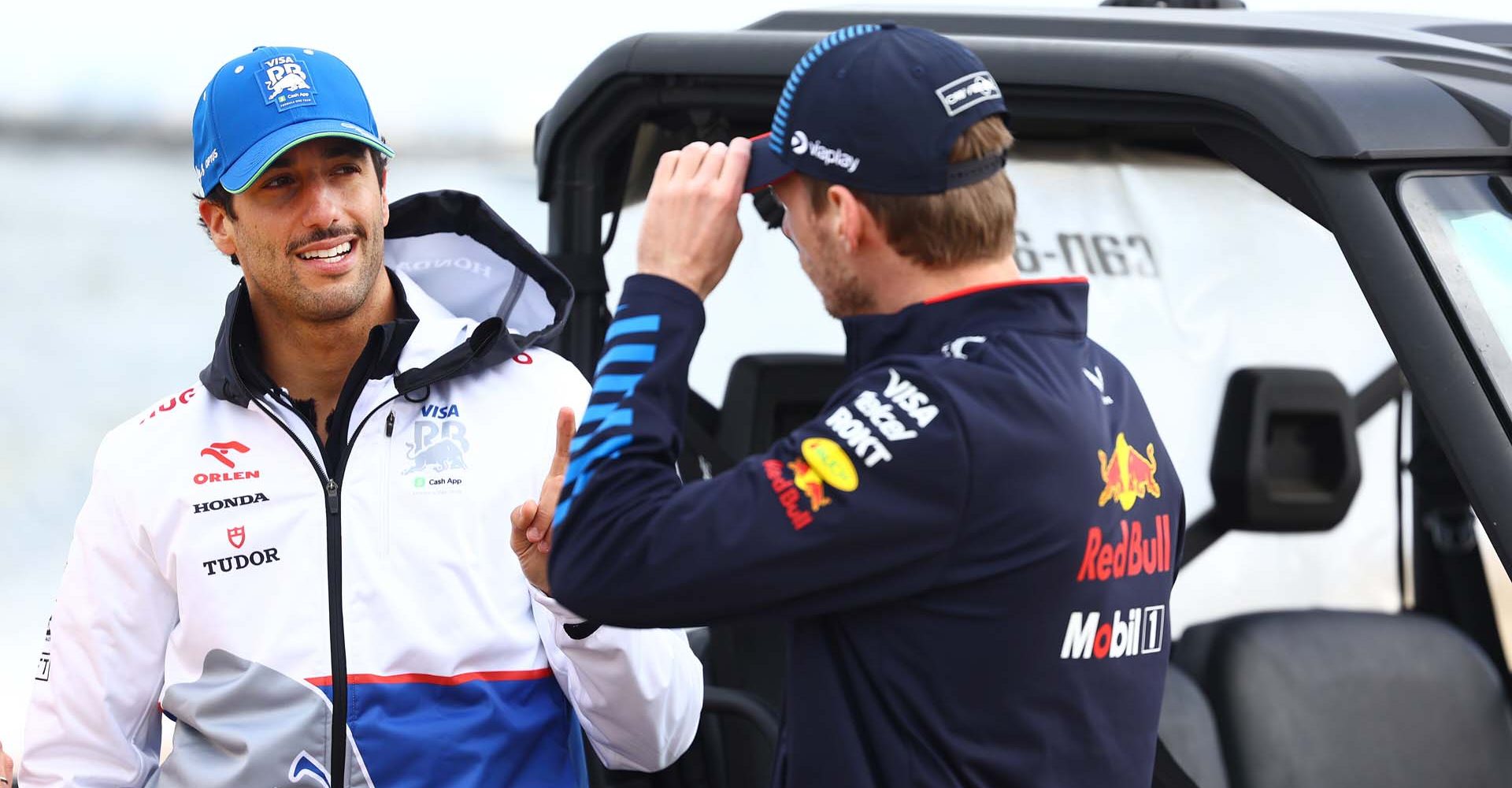 MELBOURNE, AUSTRALIA - MARCH 20: Daniel Ricciardo of Australia and Visa Cash App RB and Max Verstappen of the Netherlands and Oracle Red Bull Racing talk during previews ahead of the F1 Grand Prix of Australia at Albert Park Circuit on March 20, 2024 in Melbourne, Australia. (Photo by Mark Thompson/Getty Images) // Getty Images / Red Bull Content Pool // SI202403201025 // Usage for editorial use only //