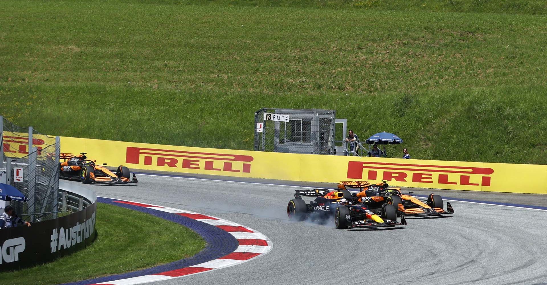 RED BULL RING, AUSTRIA - JUNE 29: Max Verstappen, Red Bull Racing RB20, locks up with Lando Norris, McLaren MCL38 just behind during the Austrian GP at Red Bull Ring on Saturday June 29, 2024 in Spielberg, Austria. (Photo by Steven Tee / LAT Images)