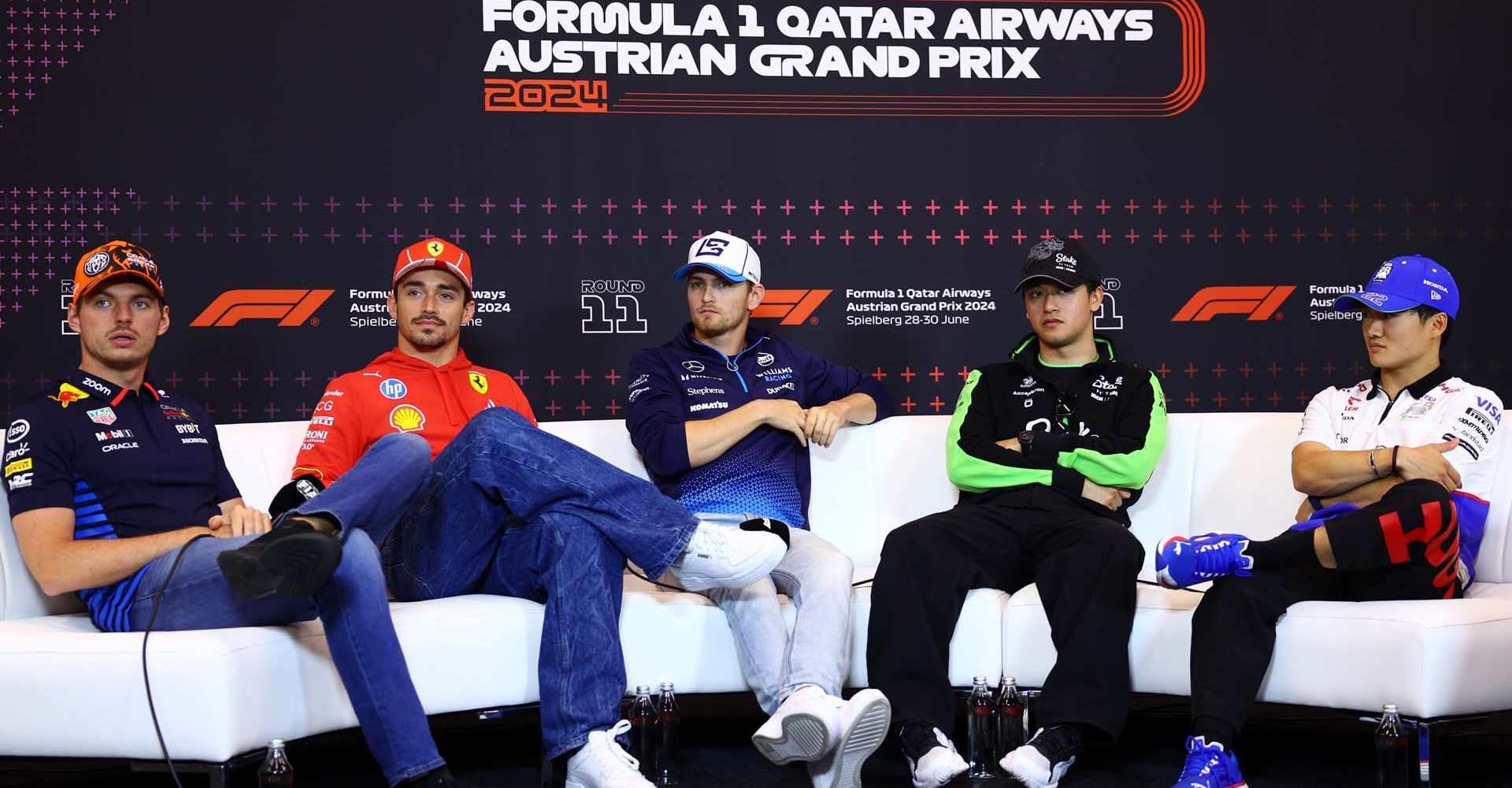 SPIELBERG, AUSTRIA - JUNE 27: Max Verstappen of the Netherlands and Oracle Red Bull Racing, Charles Leclerc of Monaco and Ferrari, Logan Sargeant of United States and Williams, Zhou Guanyu of China and Stake F1 Team Kick Sauber and Yuki Tsunoda of Japan and Visa Cash App RB attend the Drivers Press Conference during previews ahead of the F1 Grand Prix of Austria at Red Bull Ring on June 27, 2024 in Spielberg, Austria. (Photo by Clive Rose/Getty Images) // Getty Images / Red Bull Content Pool // SI202406270493 // Usage for editorial use only //