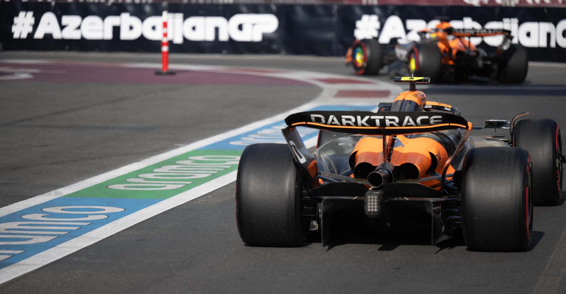 Lando Norris, McLaren MCL38, in the pit lane