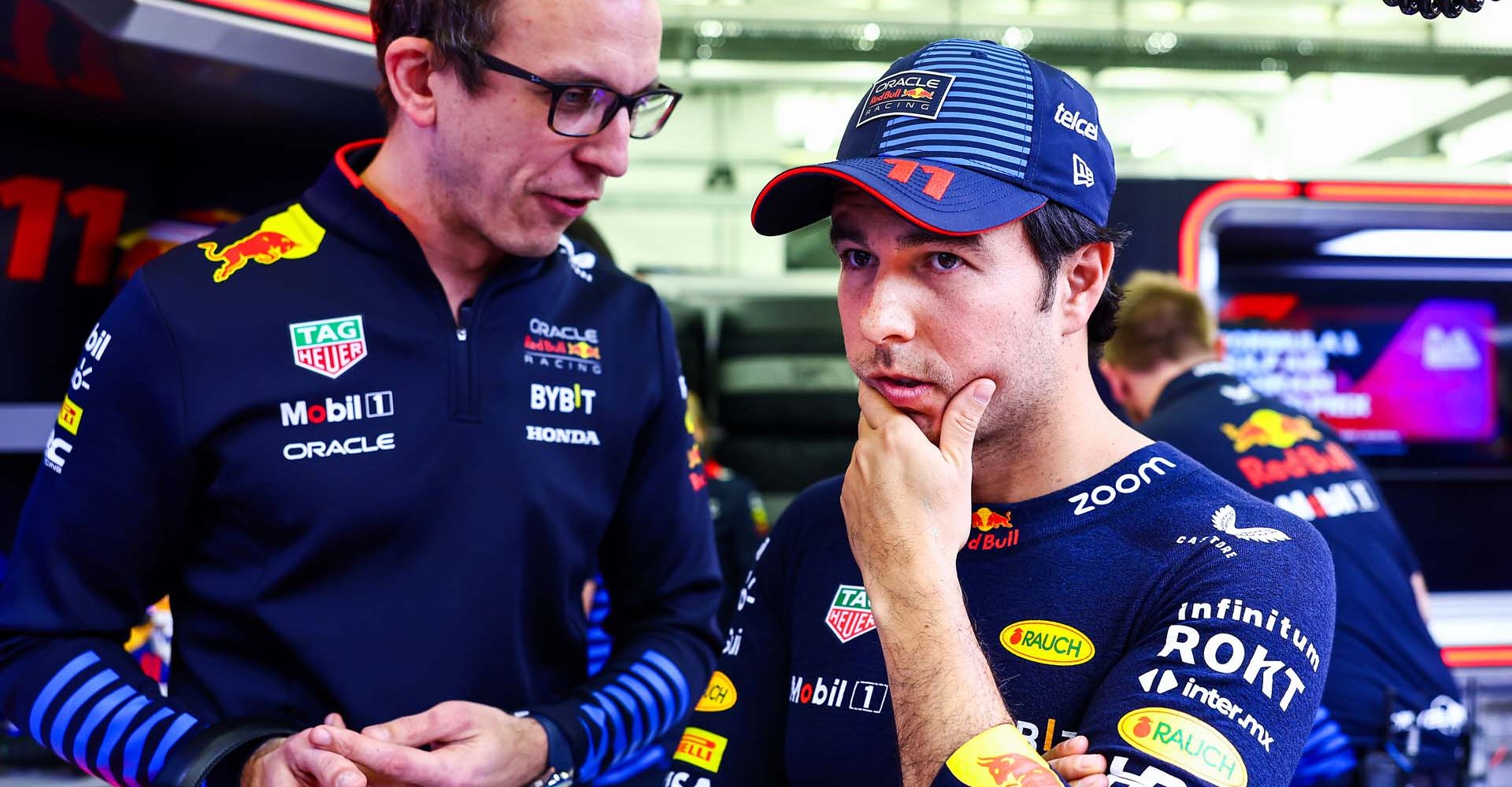 BAHRAIN, BAHRAIN - MARCH 01: Sergio Perez of Mexico and Oracle Red Bull Racing talks with race engineer Hugh Bird in the garage during qualifying ahead of the F1 Grand Prix of Bahrain at Bahrain International Circuit on March 01, 2024 in Bahrain, Bahrain. (Photo by Mark Thompson/Getty Images) // Getty Images / Red Bull Content Pool // SI202403010578 // Usage for editorial use only //