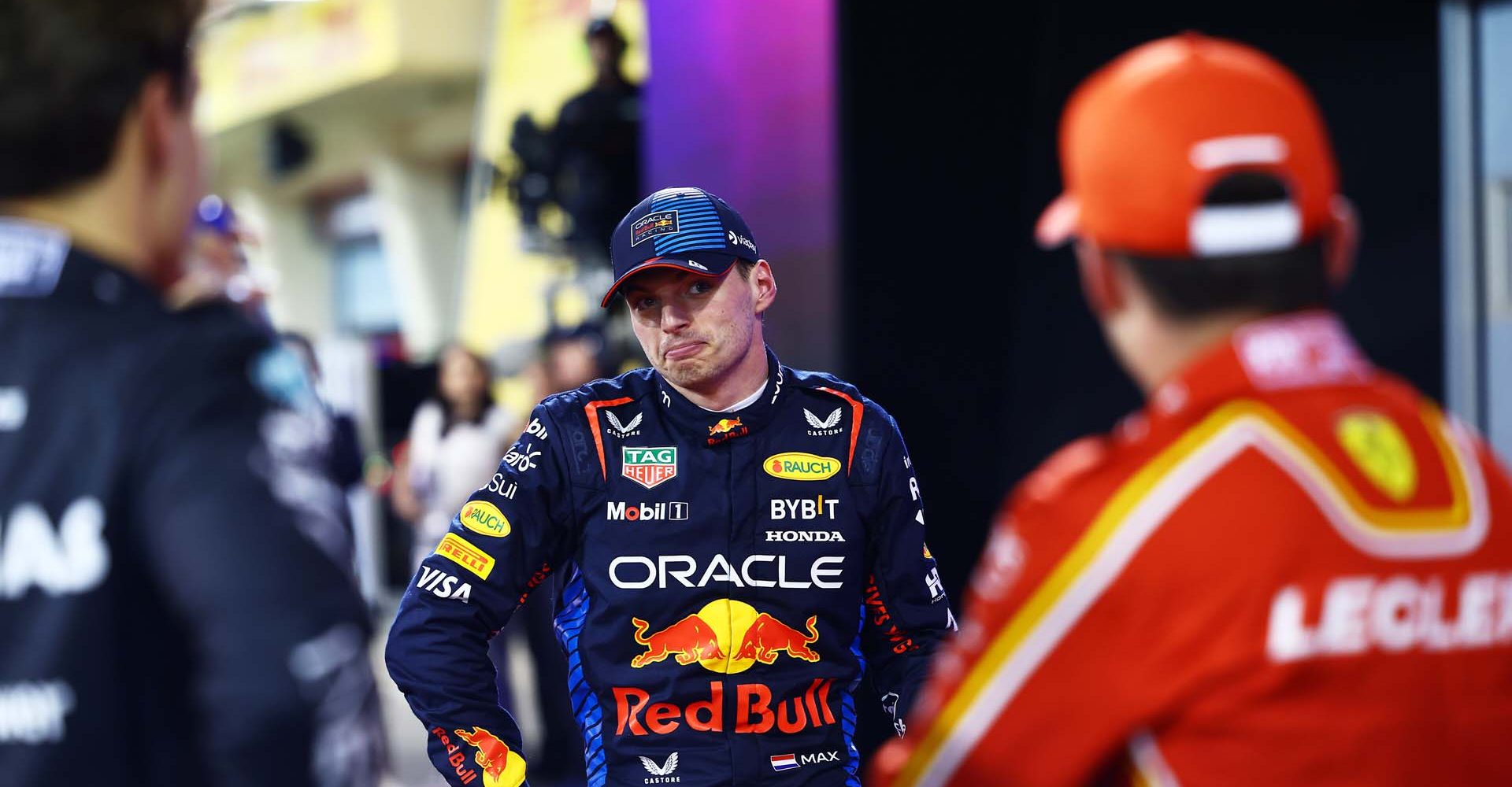 BAHRAIN, BAHRAIN - MARCH 01: Pole position qualifier Max Verstappen of the Netherlands and Oracle Red Bull Racing talks with Second placed qualifier Charles Leclerc of Monaco and Ferrari and Third placed qualifier George Russell of Great Britain and Mercedes in parc ferme during qualifying ahead of the F1 Grand Prix of Bahrain at Bahrain International Circuit on March 01, 2024 in Bahrain, Bahrain. (Photo by Mark Thompson/Getty Images) // Getty Images / Red Bull Content Pool // SI202403010714 // Usage for editorial use only //