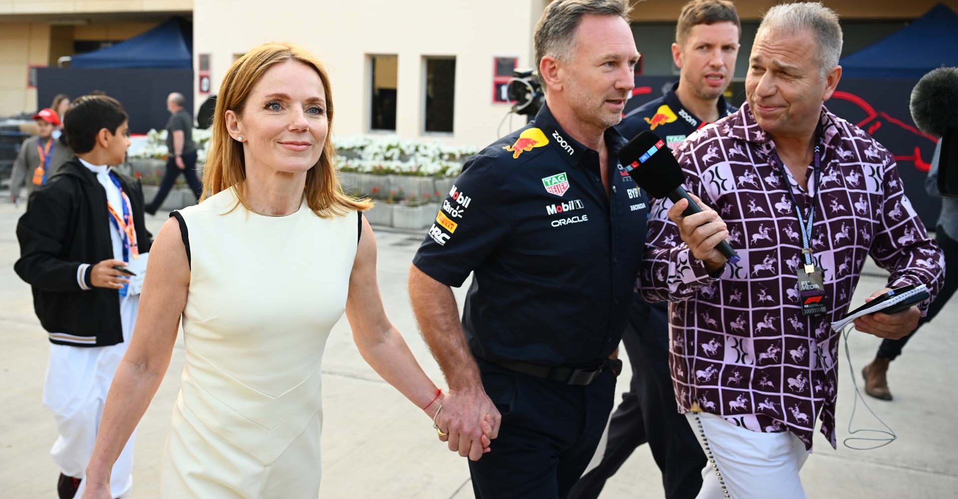 BAHRAIN, BAHRAIN - MARCH 02: Oracle Red Bull Racing Team Principal Christian Horner and Geri Horner walk in the Paddock holding hands prior to the F1 Grand Prix of Bahrain at Bahrain International Circuit on March 02, 2024 in Bahrain, Bahrain. (Photo by Clive Mason/Getty Images) // Getty Images / Red Bull Content Pool // SI202403020239 // Usage for editorial use only //