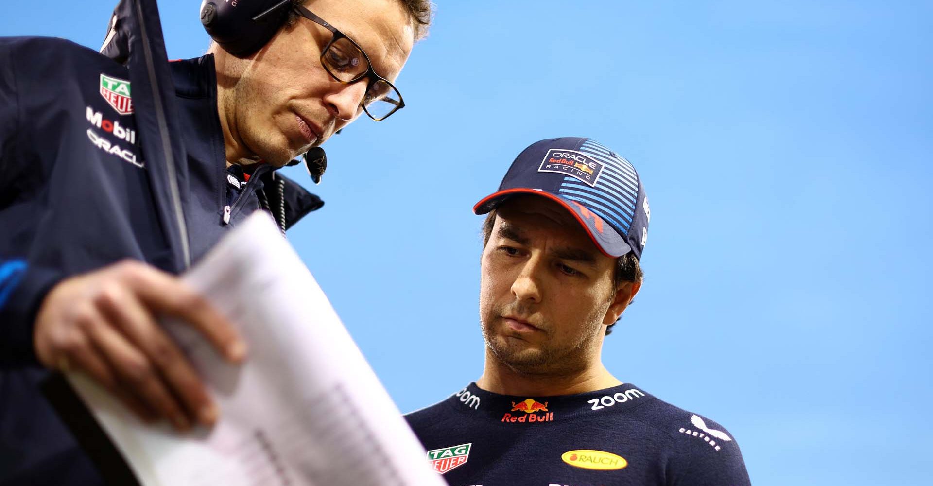 BAHRAIN, BAHRAIN - MARCH 02: Sergio Perez of Mexico and Oracle Red Bull Racing talks with race engineer Hugh Bird on the grid prior to the F1 Grand Prix of Bahrain at Bahrain International Circuit on March 02, 2024 in Bahrain, Bahrain. (Photo by Clive Rose/Getty Images) // Getty Images / Red Bull Content Pool // SI202403020321 // Usage for editorial use only //