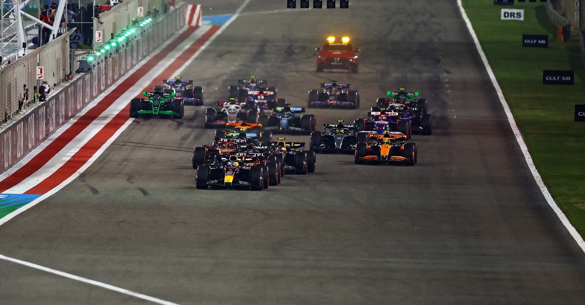 BAHRAIN, BAHRAIN - MARCH 02: Max Verstappen of the Netherlands driving the (1) Oracle Red Bull Racing RB20 leads Charles Leclerc of Monaco driving the (16) Ferrari SF-24 and the rest of the field into the first corner at the start of the race during the F1 Grand Prix of Bahrain at Bahrain International Circuit on March 02, 2024 in Bahrain, Bahrain. (Photo by Mark Thompson/Getty Images) // Getty Images / Red Bull Content Pool // SI202403020329 // Usage for editorial use only //