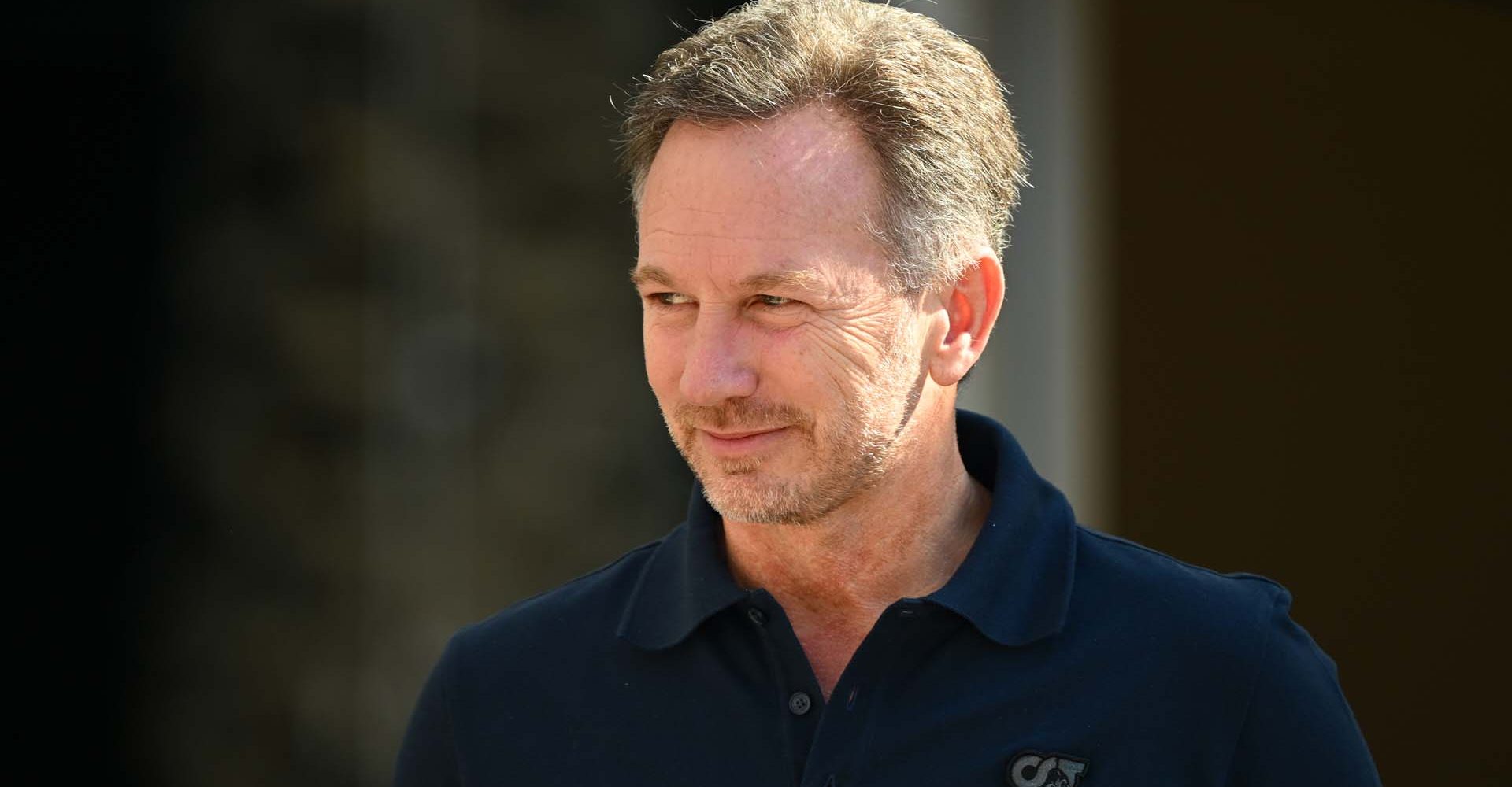 BAHRAIN, BAHRAIN - FEBRUARY 21: Red Bull Racing Team Principal Christian Horner looks on in the Paddock during day one of F1 Testing at Bahrain International Circuit on February 21, 2024 in Bahrain, Bahrain. (Photo by Clive Mason/Getty Images) // Getty Images / Red Bull Content Pool // SI202402210899 // Usage for editorial use only //