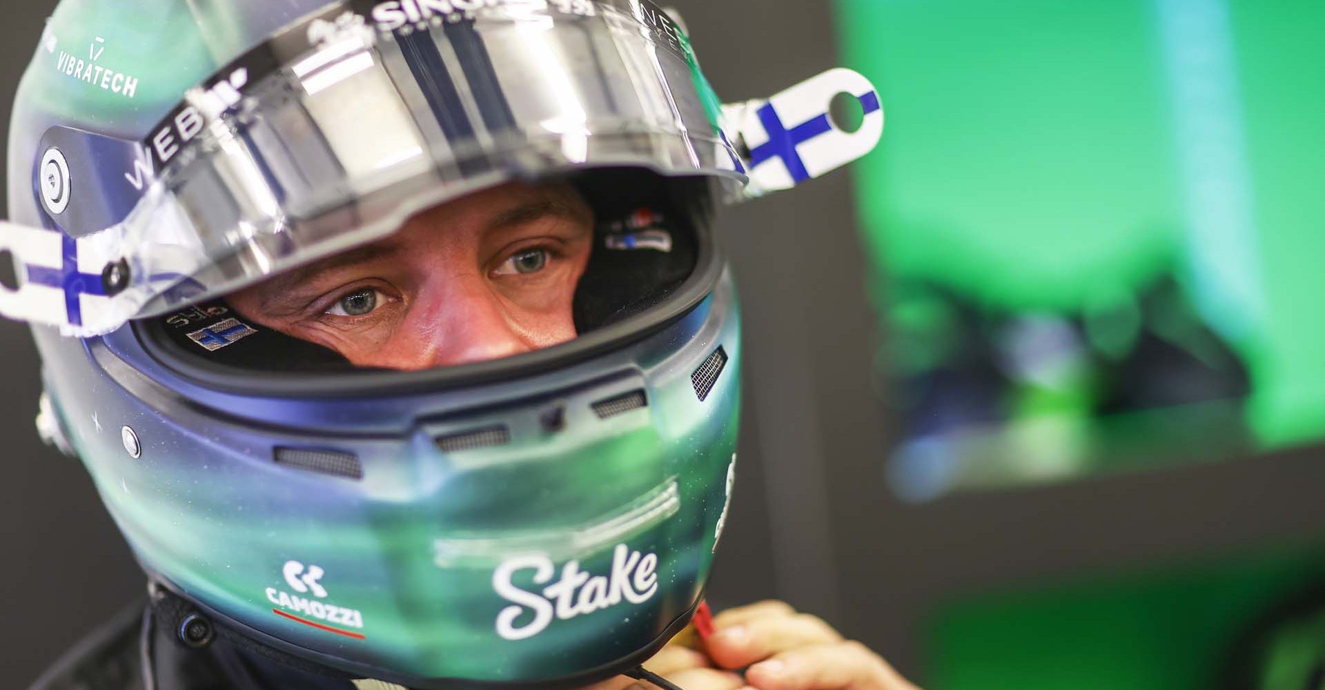 Valtteri Bottas, Stake F1 Team Kick Sauber, adjusts his helmet