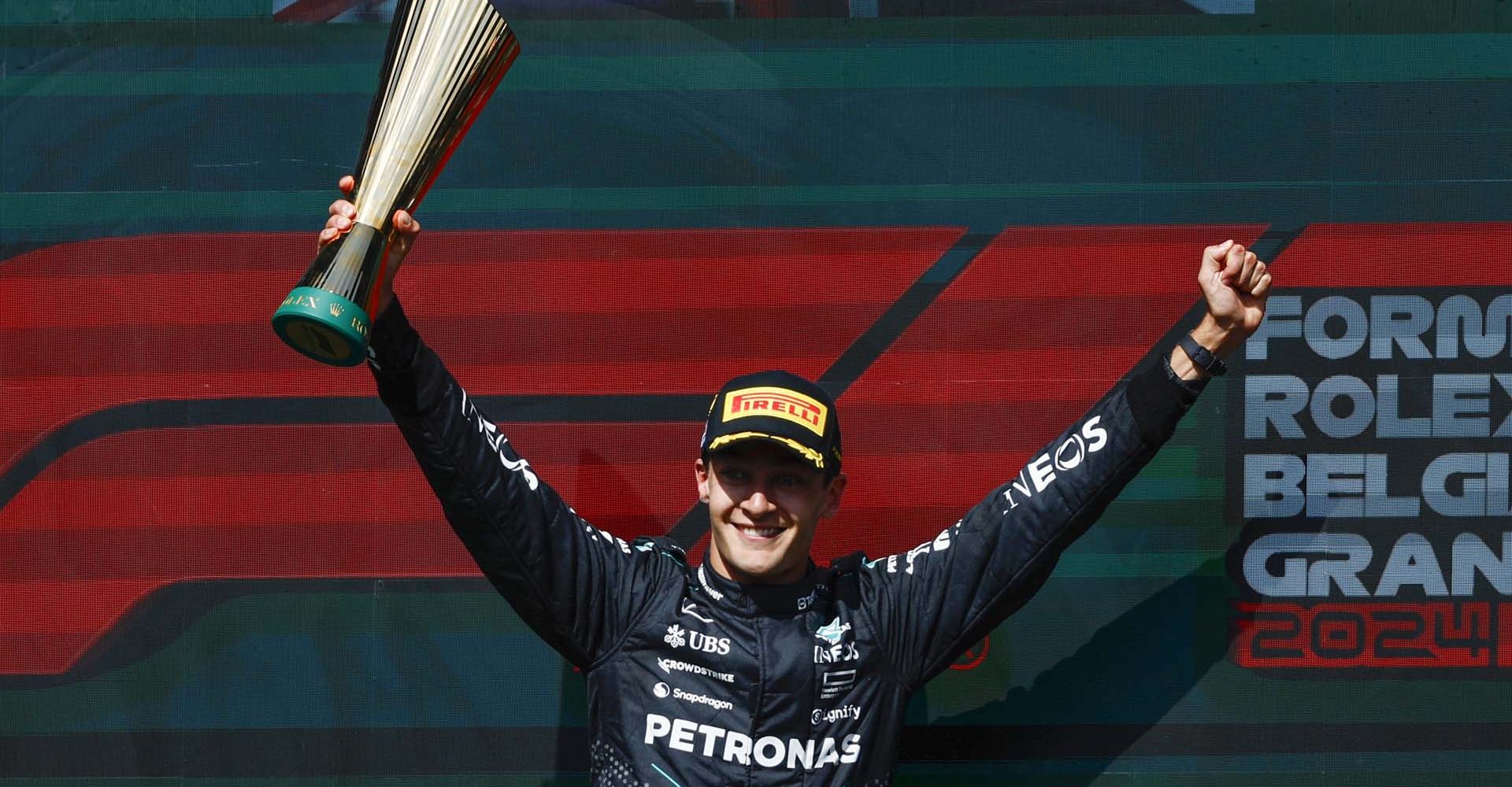 CIRCUIT DE SPA FRANCORCHAMPS, BELGIUM - JULY 28: George Russell, Mercedes-AMG F1 Team, 1st position, lifts the trophy in celebration during the Belgian GP at Circuit de Spa Francorchamps on Sunday July 28, 2024 in Spa, Belgium. (Photo by Zak Mauger / LAT Images)