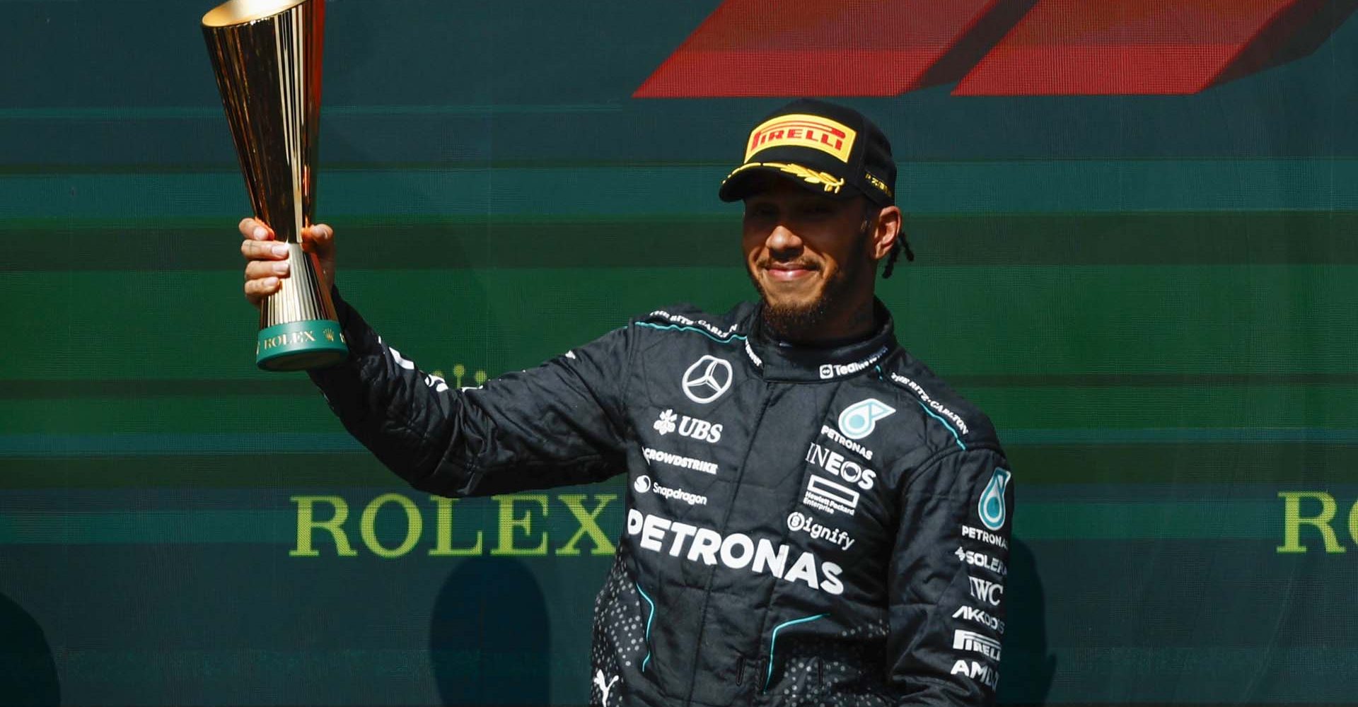 CIRCUIT DE SPA FRANCORCHAMPS, BELGIUM - JULY 28: Sir Lewis Hamilton, Mercedes-AMG F1 Team, 2nd position, holds the trophy aloft during the Belgian GP at Circuit de Spa Francorchamps on Sunday July 28, 2024 in Spa, Belgium. (Photo by Zak Mauger / LAT Images)