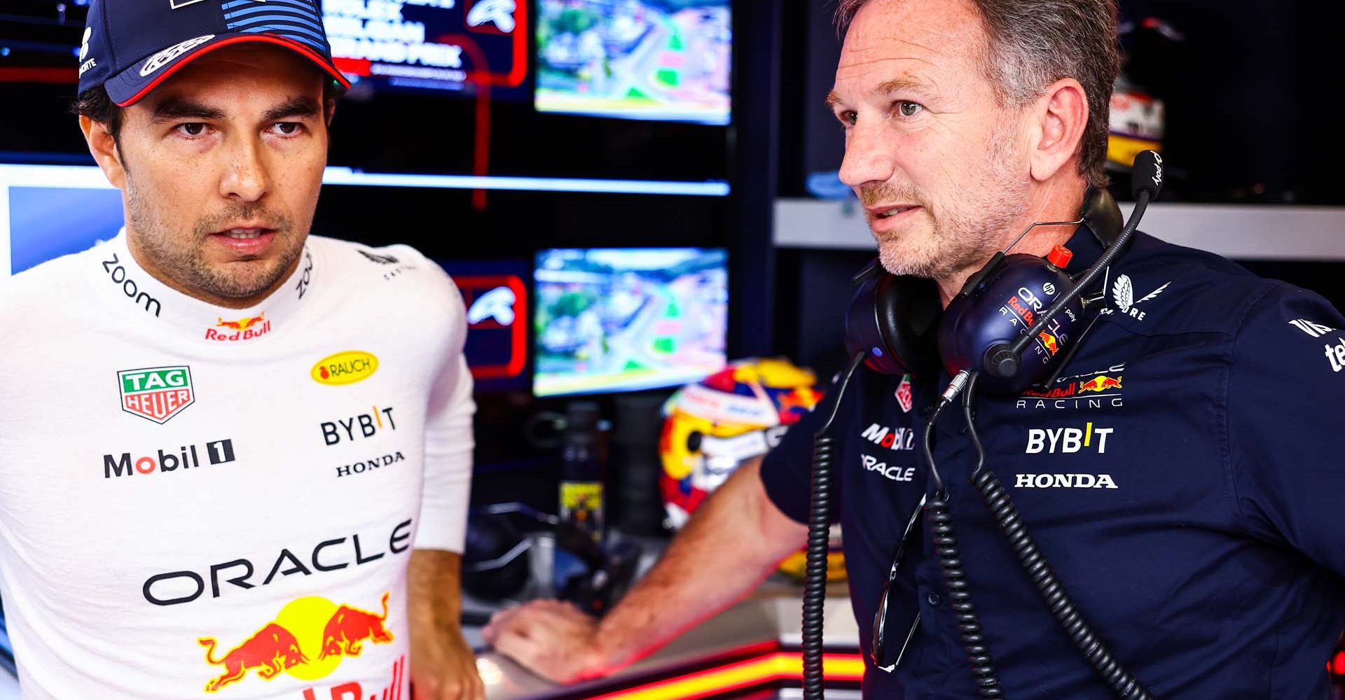 SPA, BELGIUM - JULY 28: Sergio Perez of Mexico and Oracle Red Bull Racing talks to Oracle Red Bull Racing Team Principal Christian Horner as he prepares to drive in the garage prior to the F1 Grand Prix of Belgium at Circuit de Spa-Francorchamps on July 28, 2024 in Spa, Belgium. (Photo by Mark Thompson/Getty Images) // Getty Images / Red Bull Content Pool // SI202407280336 // Usage for editorial use only //