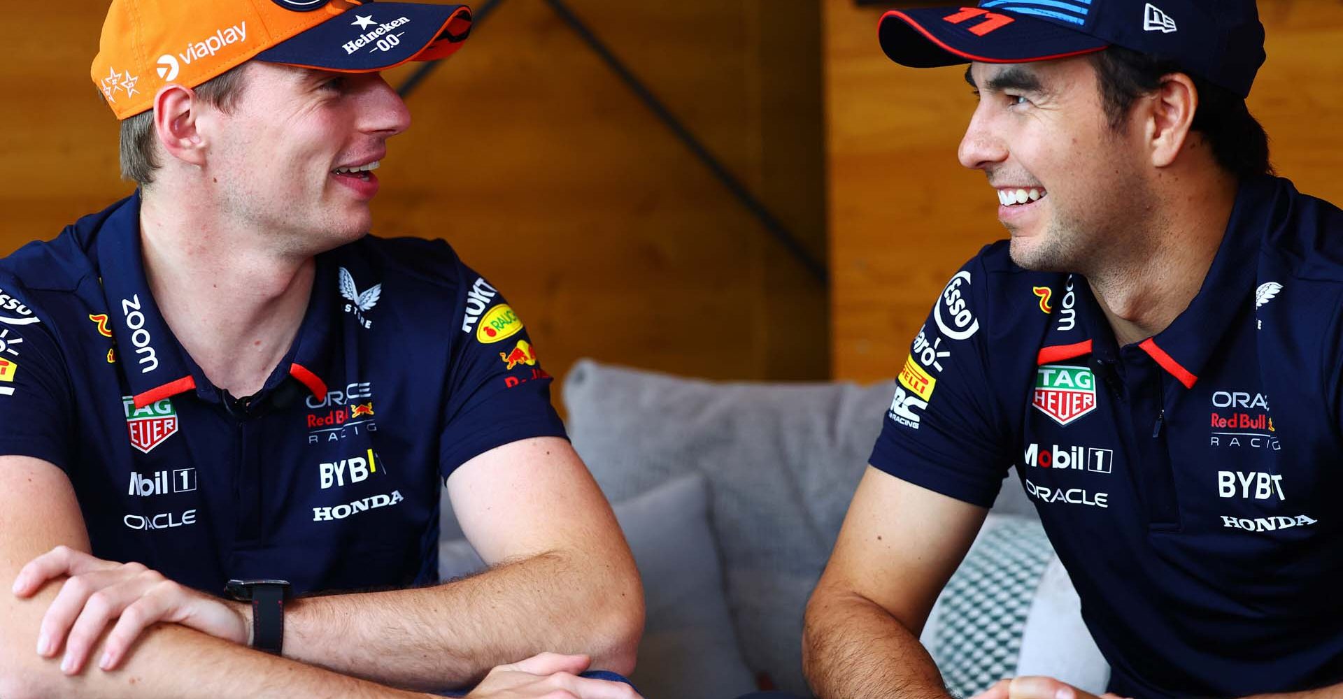 SPA, BELGIUM - JULY 25: Max Verstappen of the Netherlands and Oracle Red Bull Racing and Sergio Perez of Mexico and Oracle Red Bull Racing talk in the Paddock during previews ahead of the F1 Grand Prix of Belgium at Circuit de Spa-Francorchamps on July 25, 2024 in Spa, Belgium. (Photo by Mark Thompson/Getty Images) // Getty Images / Red Bull Content Pool // SI202407250815 // Usage for editorial use only //