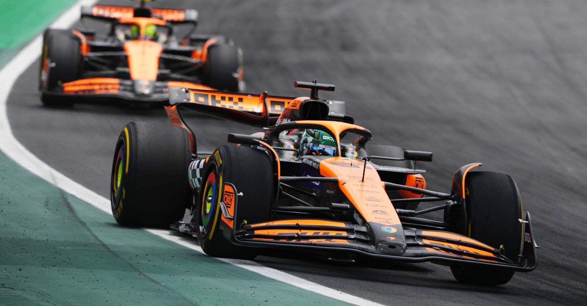 Oscar Piastri, McLaren MCL38, leads Lando Norris, McLaren MCL38