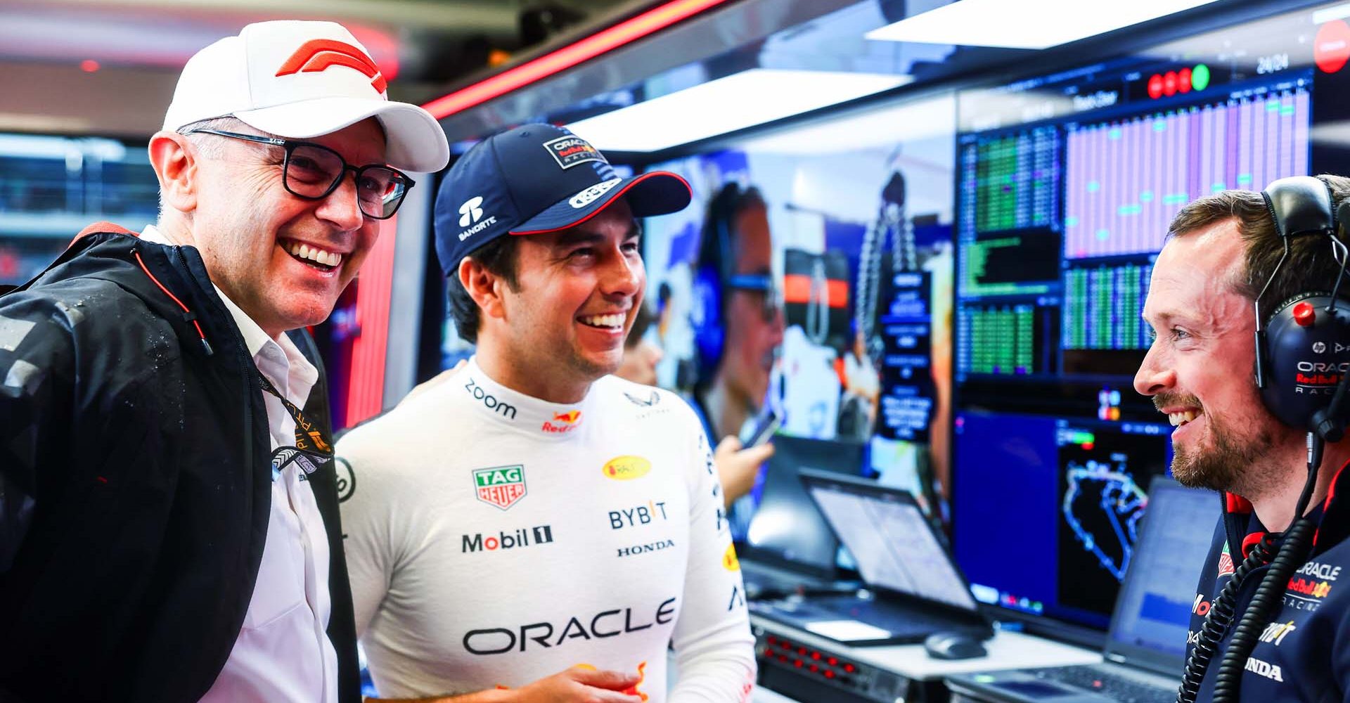 SAO PAULO, BRAZIL - NOVEMBER 02: Stefano Domenicali, CEO of the Formula One Group, talks with Sergio Perez of Mexico and Oracle Red Bull Racing in the garage as qualifying is postponed due to the weather ahead of the F1 Grand Prix of Brazil at Autodromo Jose Carlos Pace on November 02, 2024 in Sao Paulo, Brazil. (Photo by Mark Thompson/Getty Images) // Getty Images / Red Bull Content Pool // SI202411020526 // Usage for editorial use only //