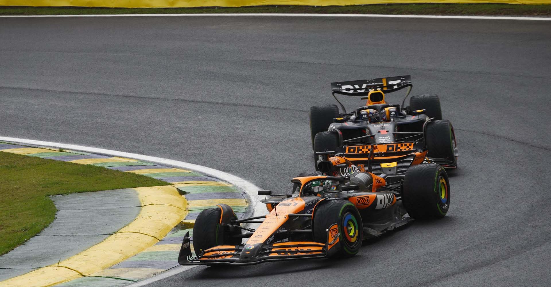 Oscar Piastri, McLaren MCL38, leads Max Verstappen, Red Bull Racing RB20 during the Brazilian GP at Autódromo José Carlos Pace