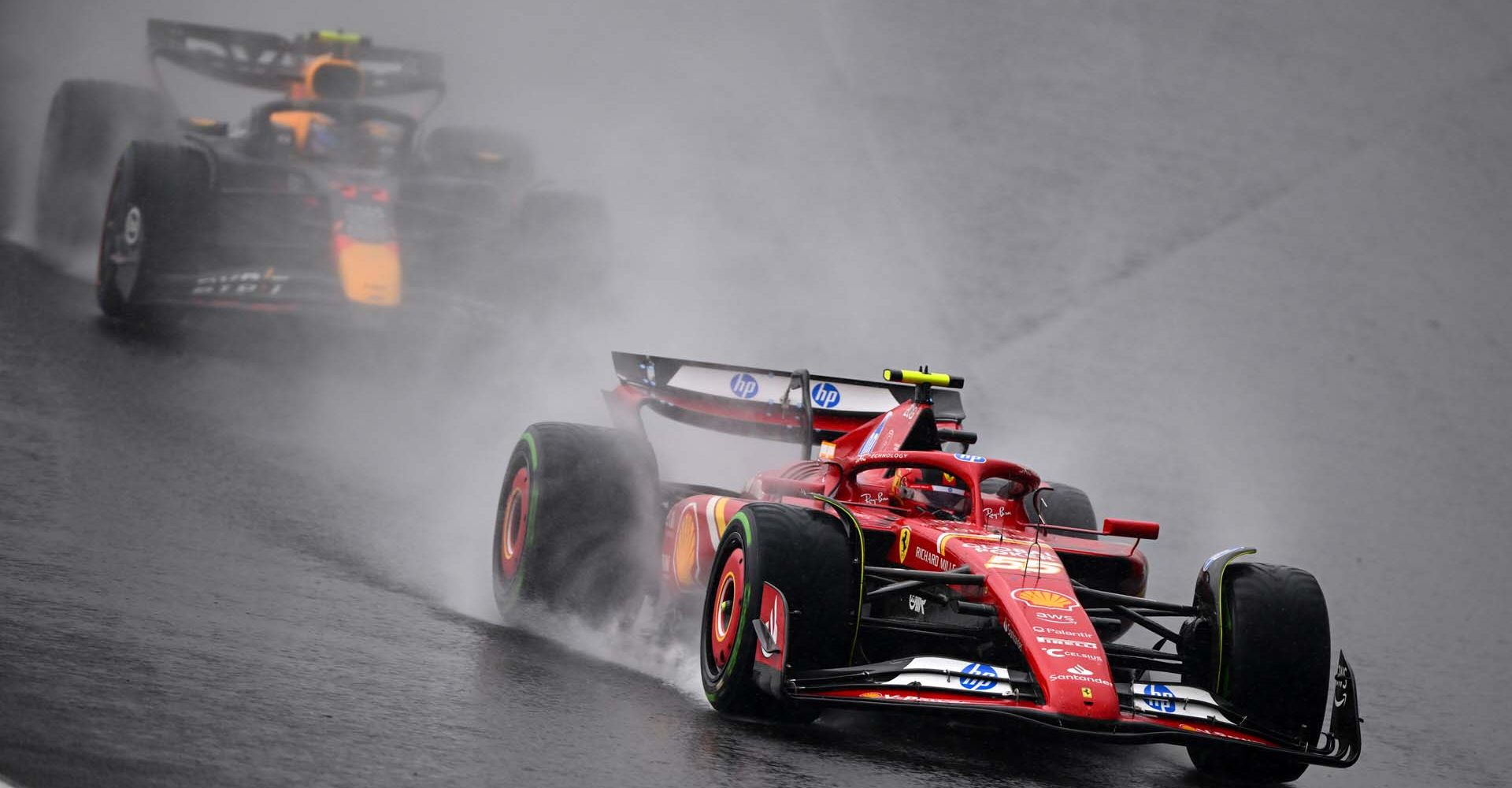 SAO PAULO, BRAZIL - NOVEMBER 03: Carlos Sainz of Spain driving (55) the Ferrari SF-24 leads Sergio Perez of Mexico driving the (11) Oracle Red Bull Racing RB20 on track during the F1 Grand Prix of Brazil at Autodromo Jose Carlos Pace on November 03, 2024 in Sao Paulo, Brazil. (Photo by Clive Mason/Getty Images) // Getty Images / Red Bull Content Pool // SI202411030414 // Usage for editorial use only //