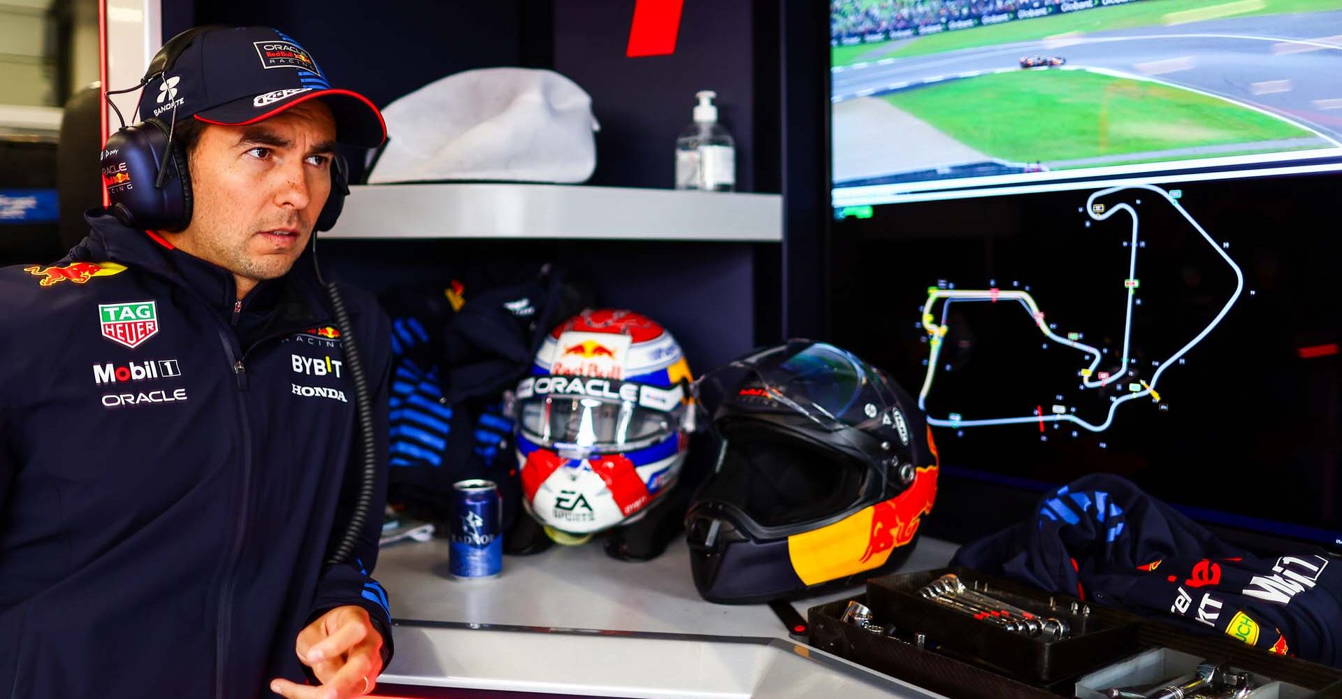 NORTHAMPTON, ENGLAND - JULY 05: Sergio Perez of Mexico and Oracle Red Bull Racing looks on in the garage during practice ahead of the F1 Grand Prix of Great Britain at Silverstone Circuit on July 05, 2024 in Northampton, England. (Photo by Mark Thompson/Getty Images) // Getty Images / Red Bull Content Pool // SI202407050300 // Usage for editorial use only //