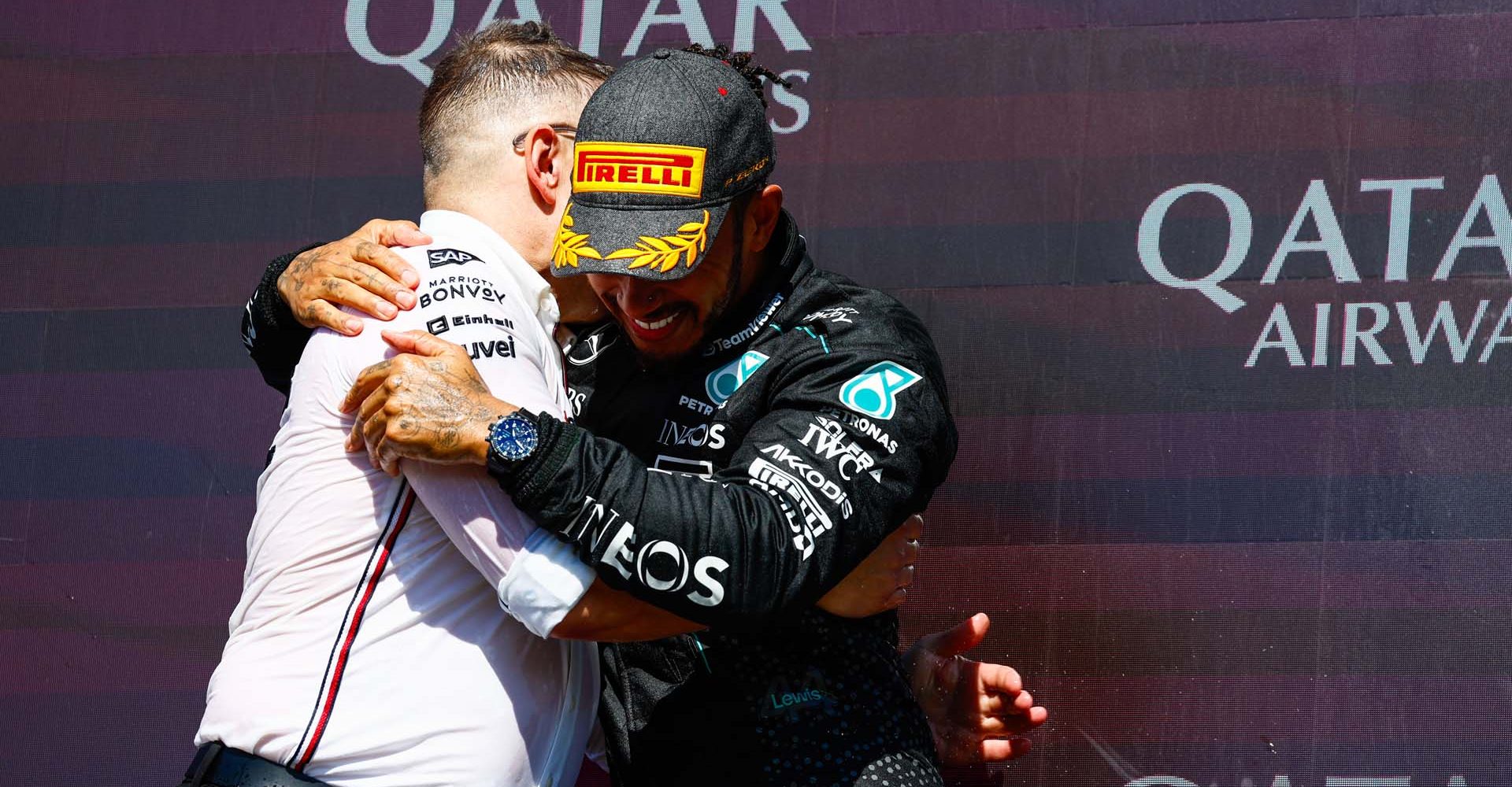 SILVERSTONE CIRCUIT, UNITED KINGDOM - JULY 07: Race winner Sir Lewis Hamilton, Mercedes-AMG F1 Team, celebrates on the podium with Peter Bonnington, Senior Race Engineer, Mercedes-AMG F1 Team during the British GP at Silverstone Circuit on Sunday July 07, 2024 in Northamptonshire, United Kingdom. (Photo by Sam Bloxham / LAT Images)