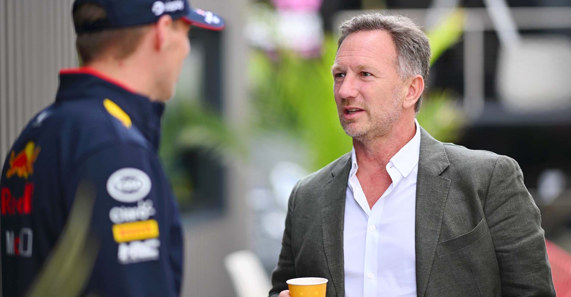 NORTHAMPTON, ENGLAND - JULY 04: Oracle Red Bull Racing Team Principal Christian Horner talks with Max Verstappen of the Netherlands and Oracle Red Bull Racing in the Paddock during previews ahead of the F1 Grand Prix of Great Britain at Silverstone Circuit on July 04, 2024 in Northampton, England. (Photo by Rudy Carezzevoli/Getty Images) // Getty Images / Red Bull Content Pool // SI202407040553 // Usage for editorial use only //